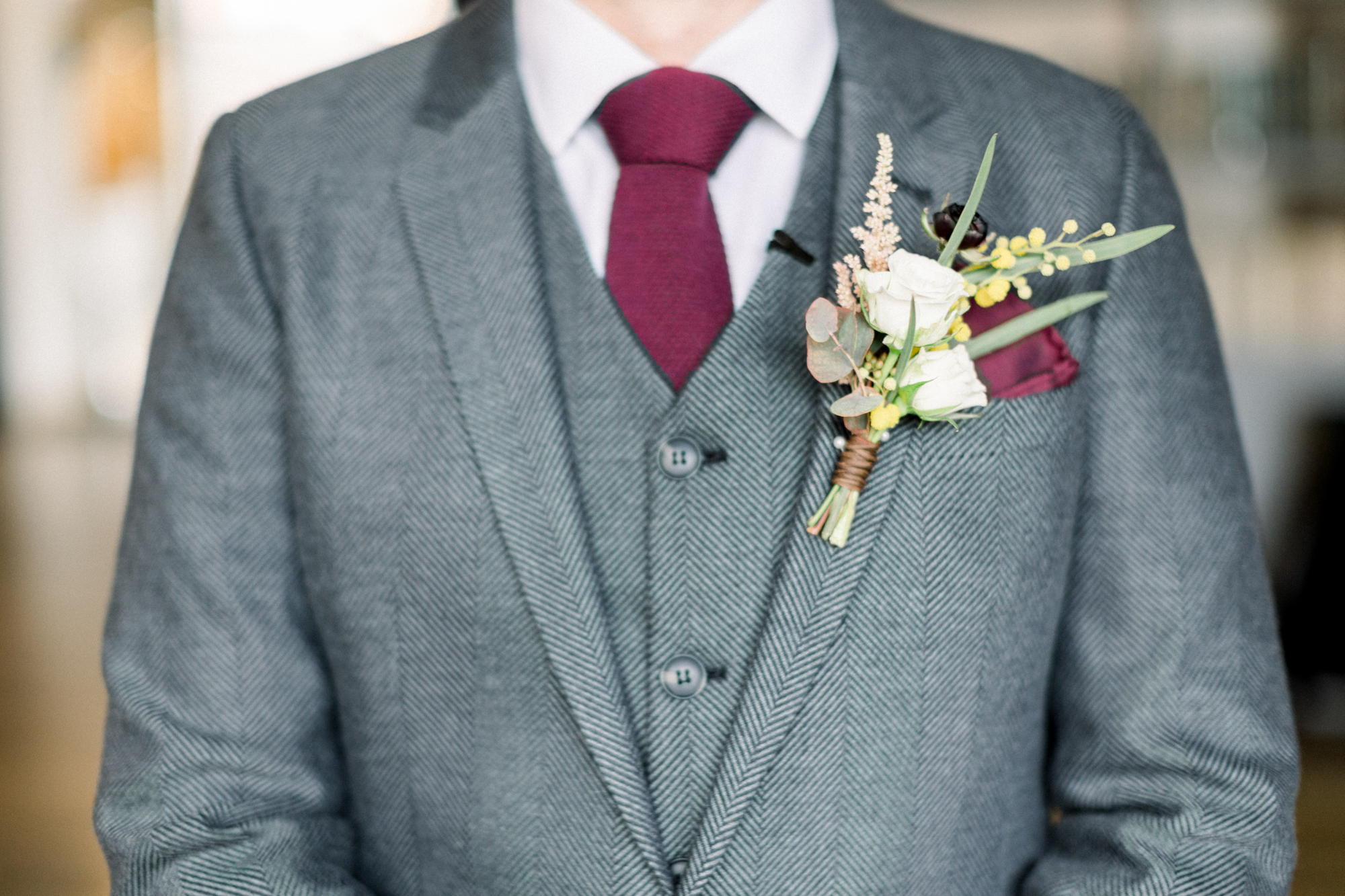Winter wedding suit with boutonniere at LIC hotel