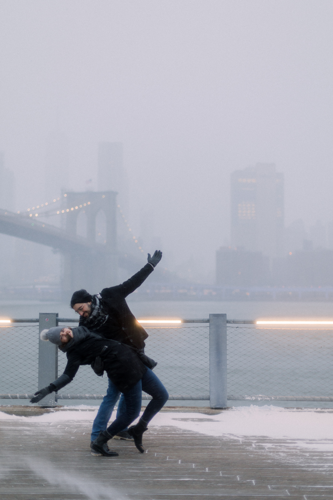 Funny candid snowstorm engagement photos