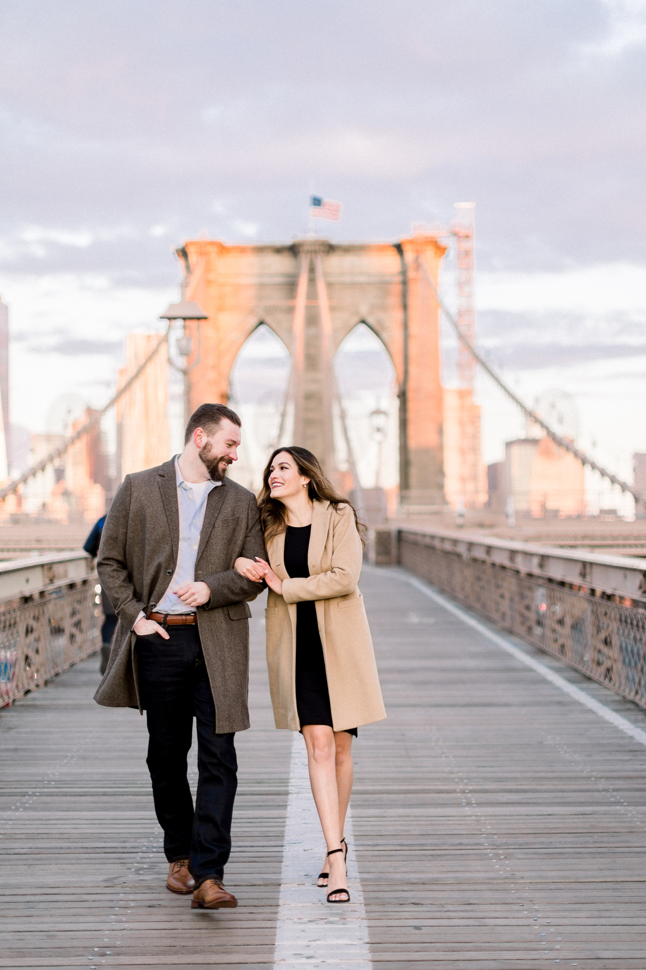 Sunrise engagement photos on the Brooklyn Bridge early in the morning