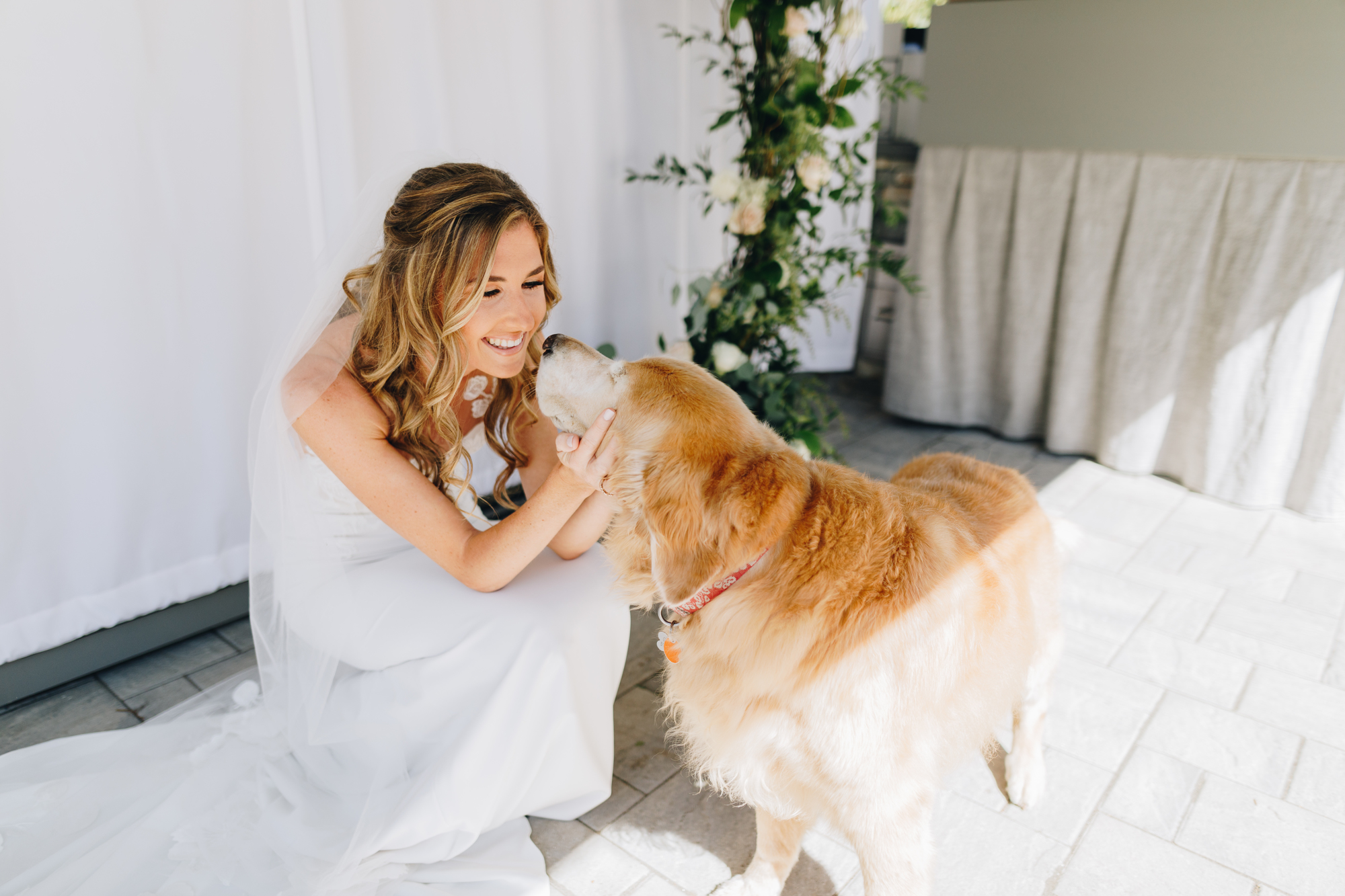 Bride with dog at backyard wedding on Long Island