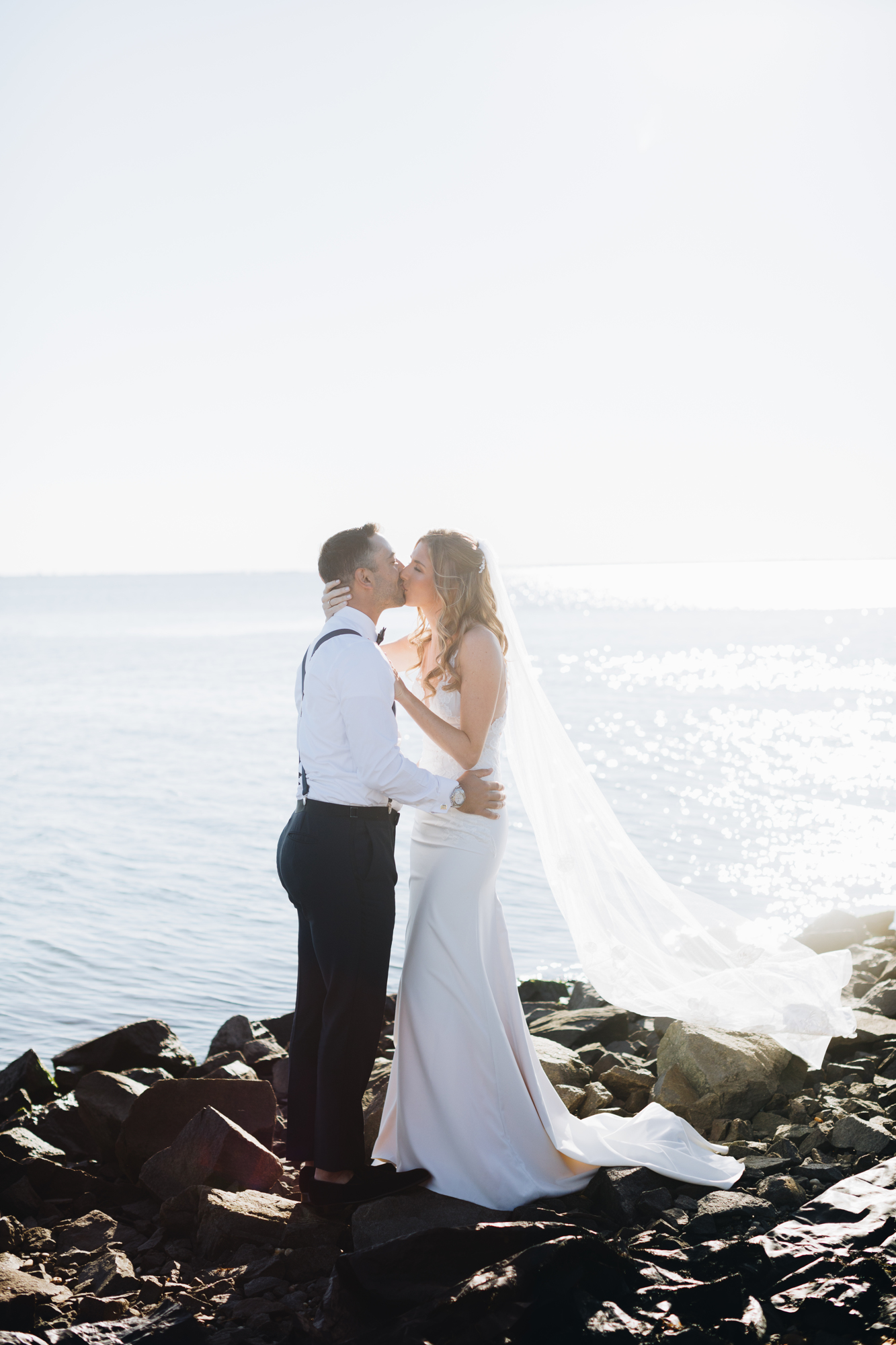 Timeless wedding photos on a rocky beach on Long Island