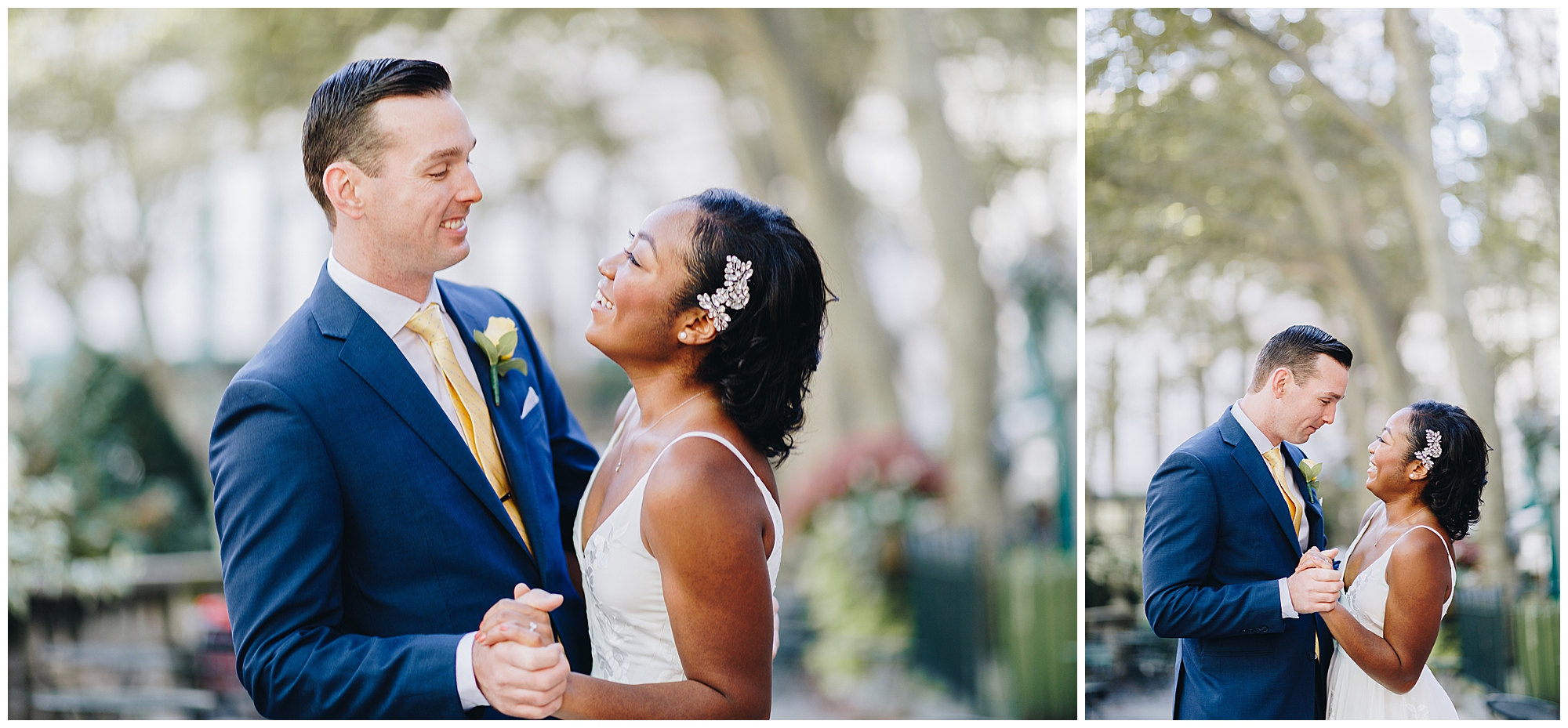 A bride and groom smile and hold hands while dancing outdoors at their Wagner Cove elopement, surrounded by greenery. The groom wears a blue suit and yellow tie; the bride wears a white dress with a hair accessory.