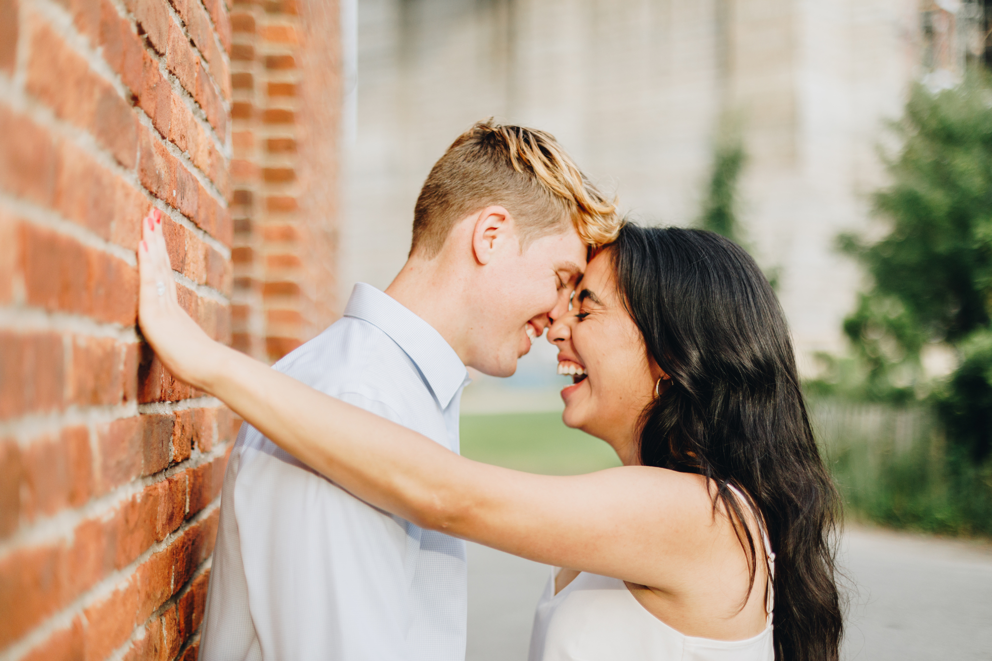 Dumbo engagement photos with brick walls in Brooklyn