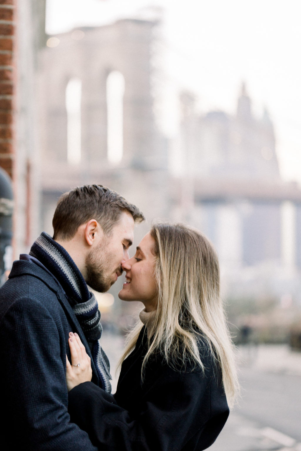 Dumbo Proposal in Winter with NYC Skyline and Brooklyn Bridge Views