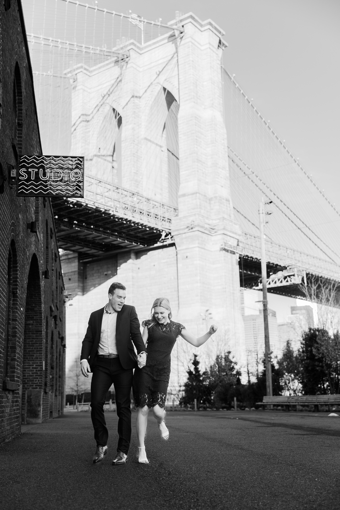 Playful Brooklyn Bridge Engagement Photos in Late Fall