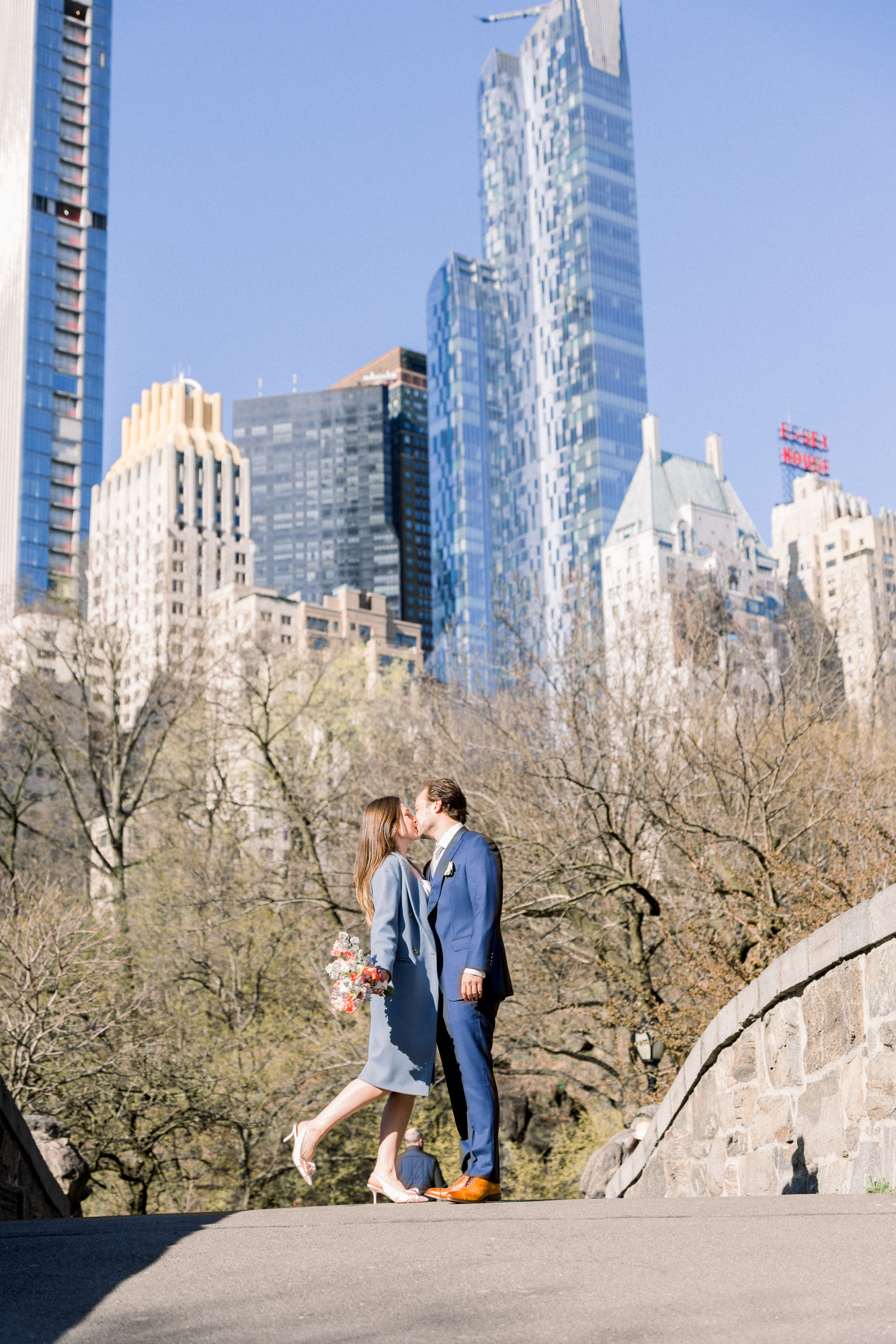 Candid Bow Bridge Wedding Photos Among Central Park's Spring Cherry Blossoms