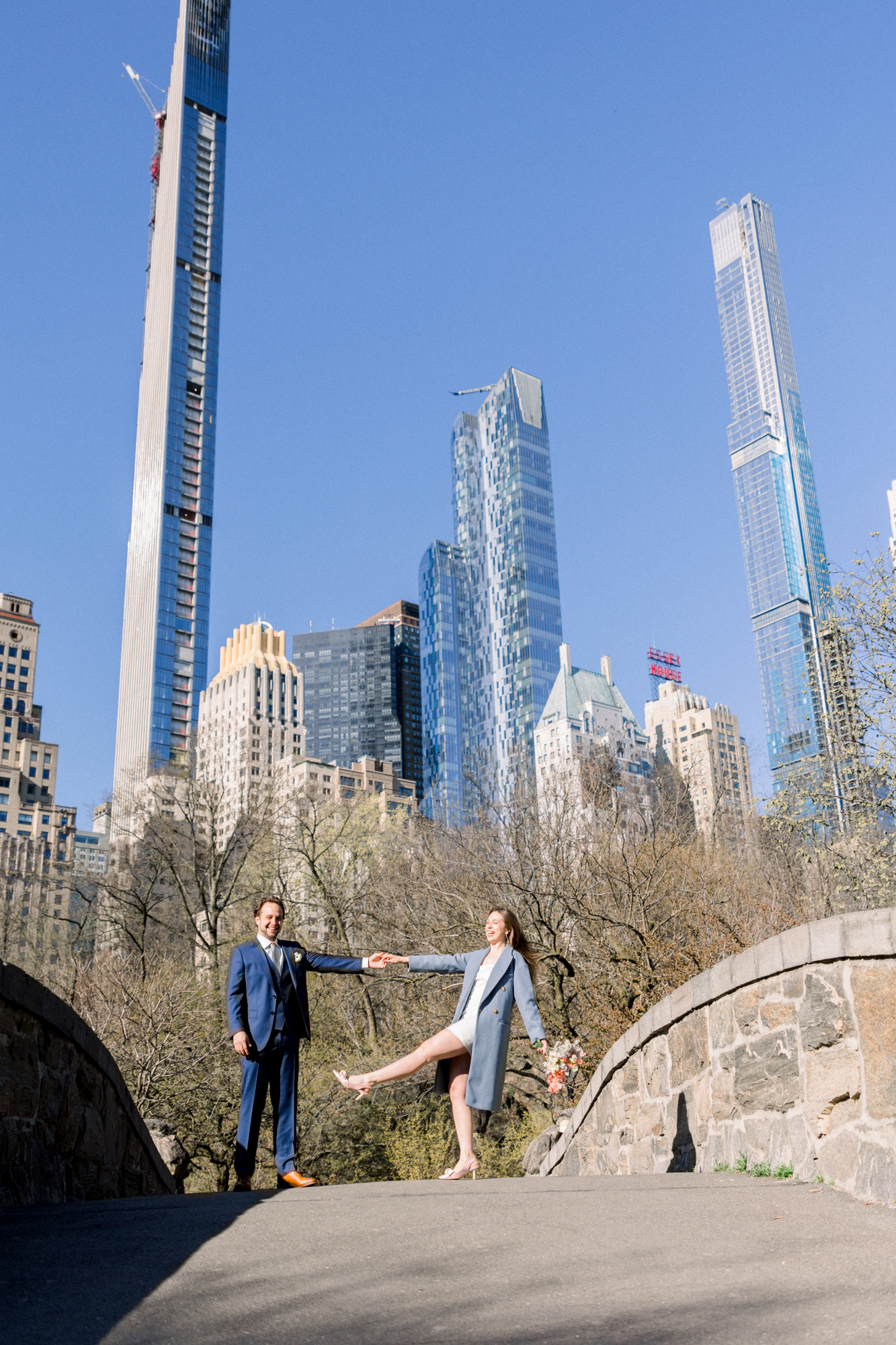 Pretty Bow Bridge Wedding Photos Among Central Park's Spring Cherry Blossoms