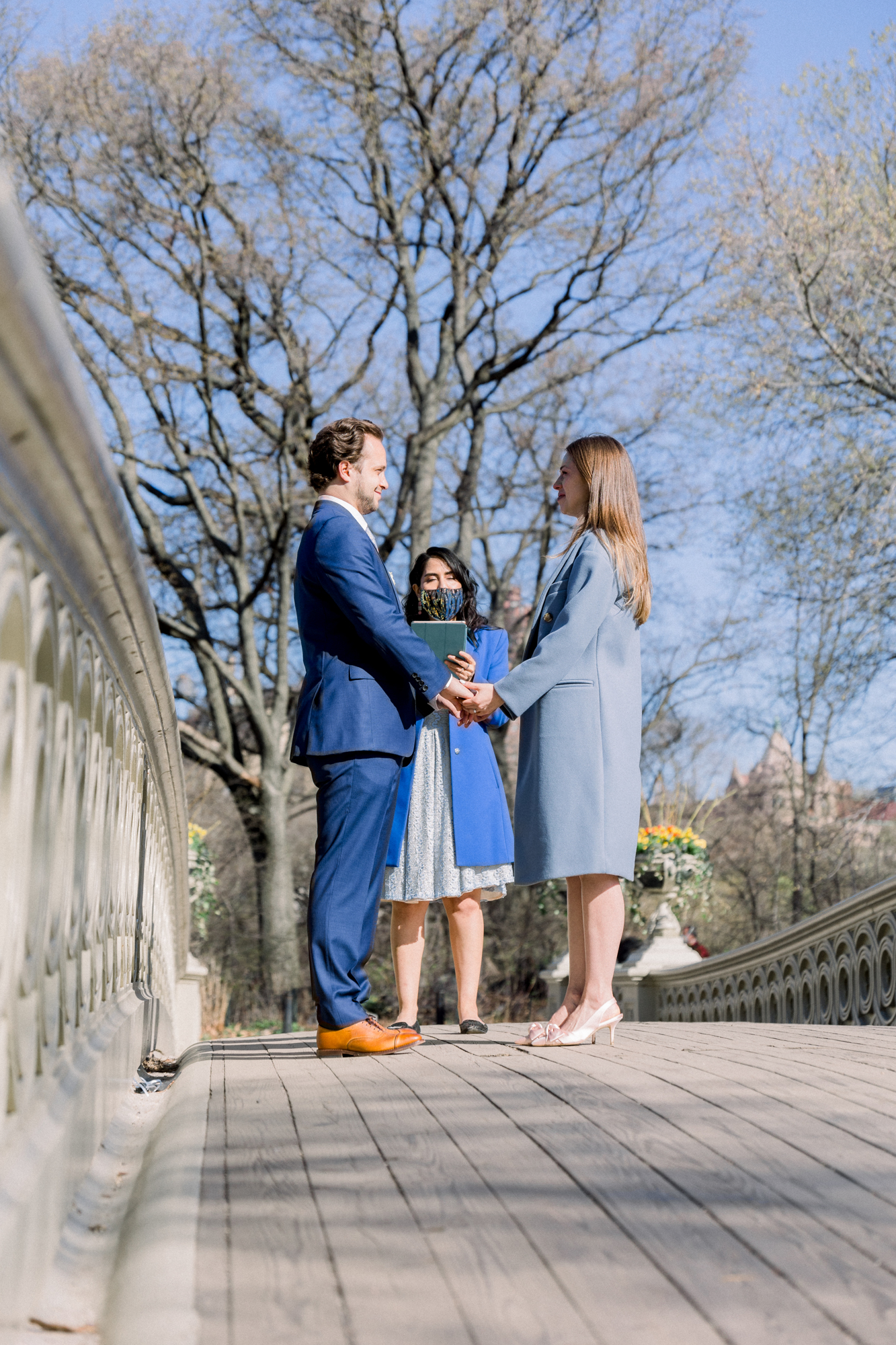 Vivid Bow Bridge Wedding Photos Among Central Park's Spring Cherry Blossoms