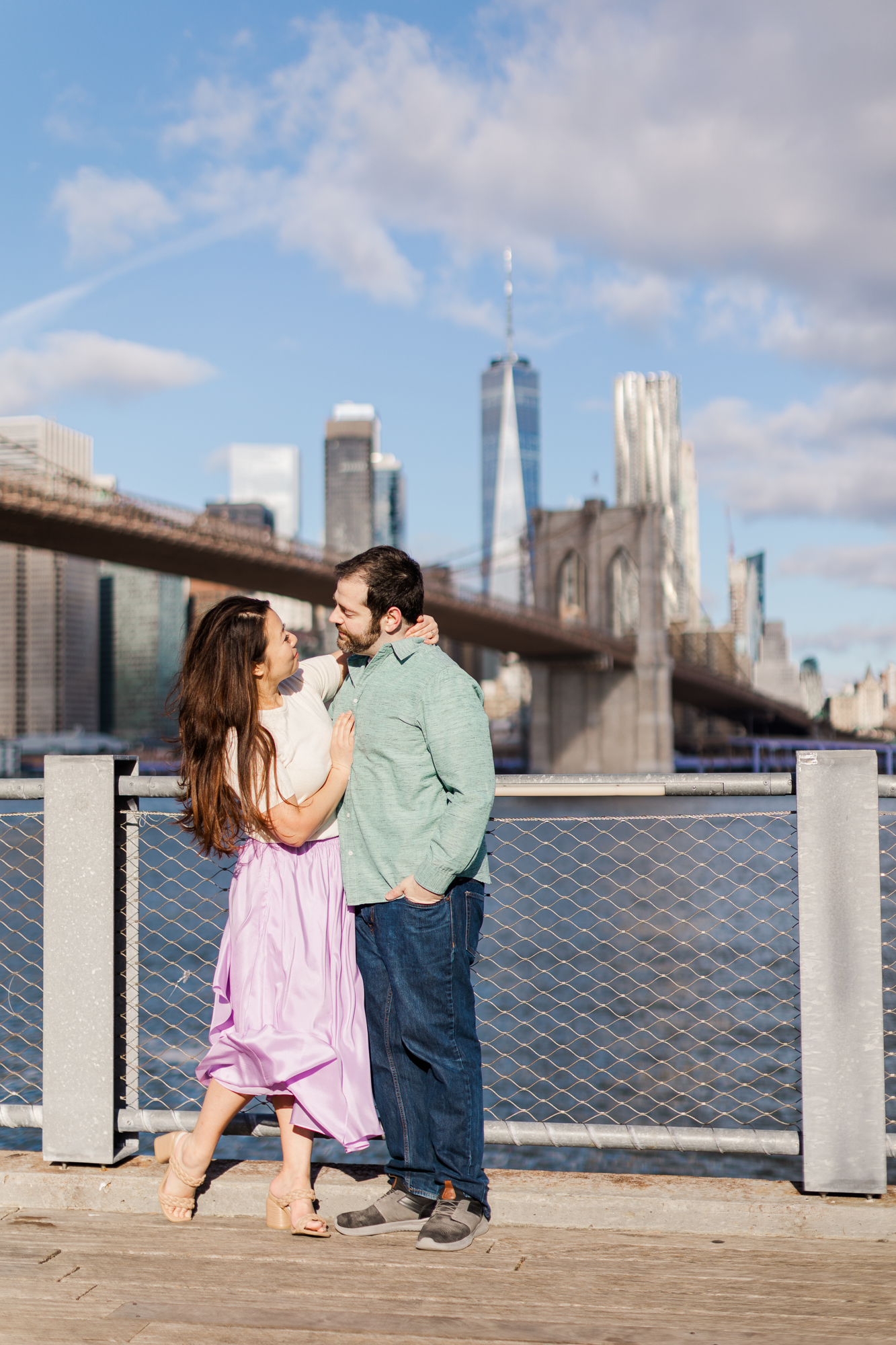 Scenic Brooklyn Bridge Engagement Photography with Matching Outfits