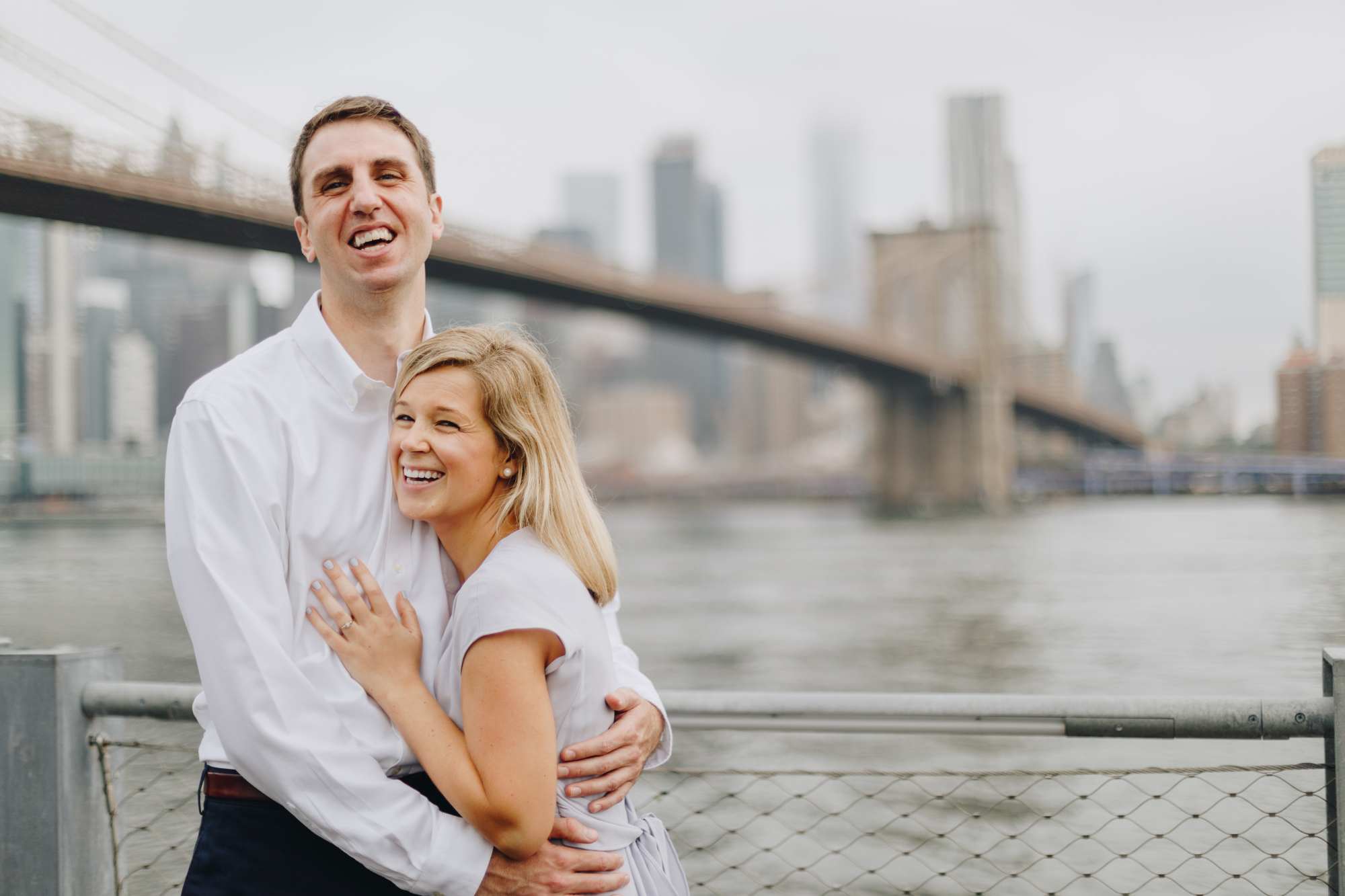 Joyful Brooklyn Bridge Park Engagement Photos on a Cloudy Day in New York