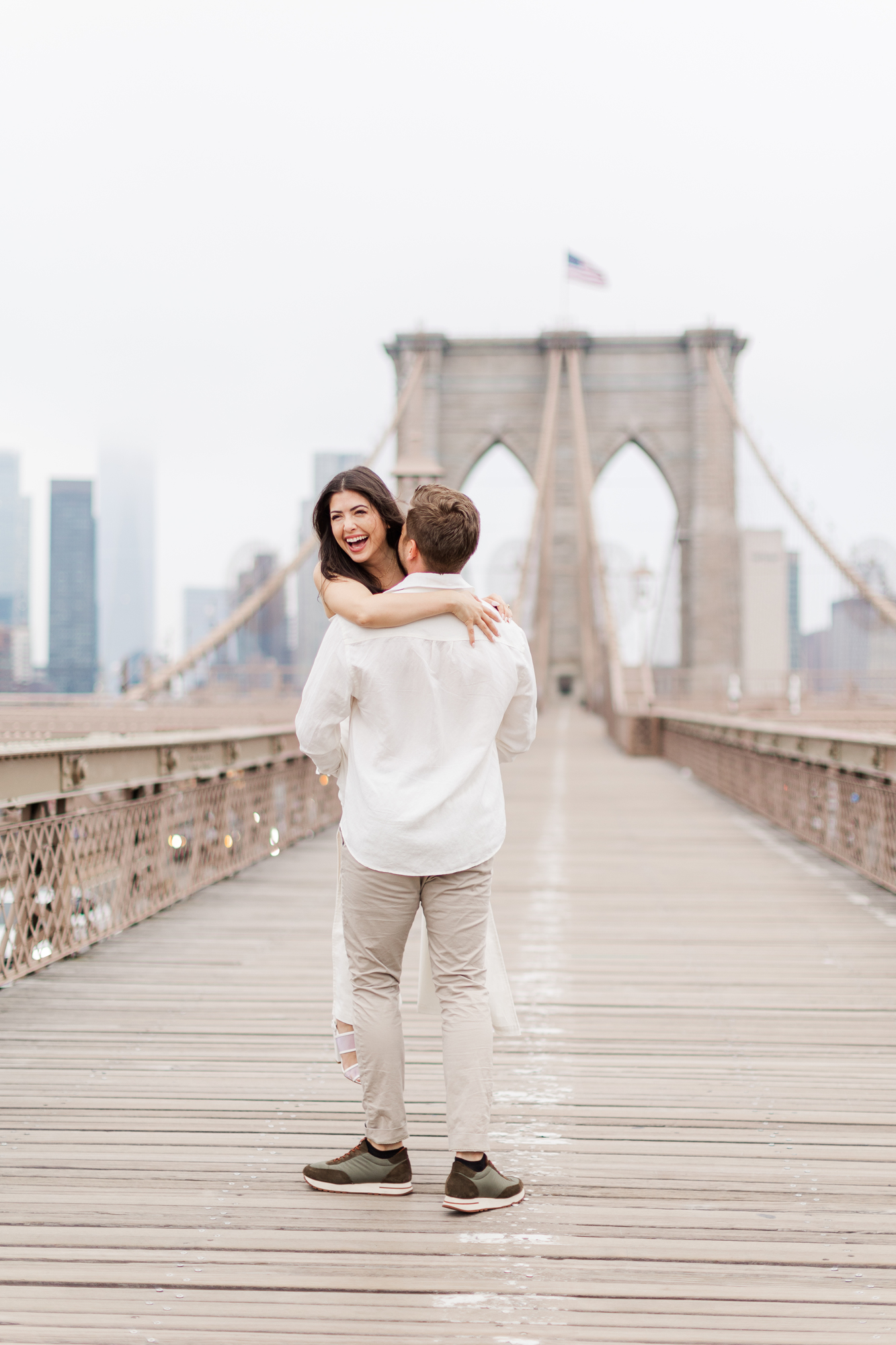Playful Engagement Photography on the Brooklyn Bridge