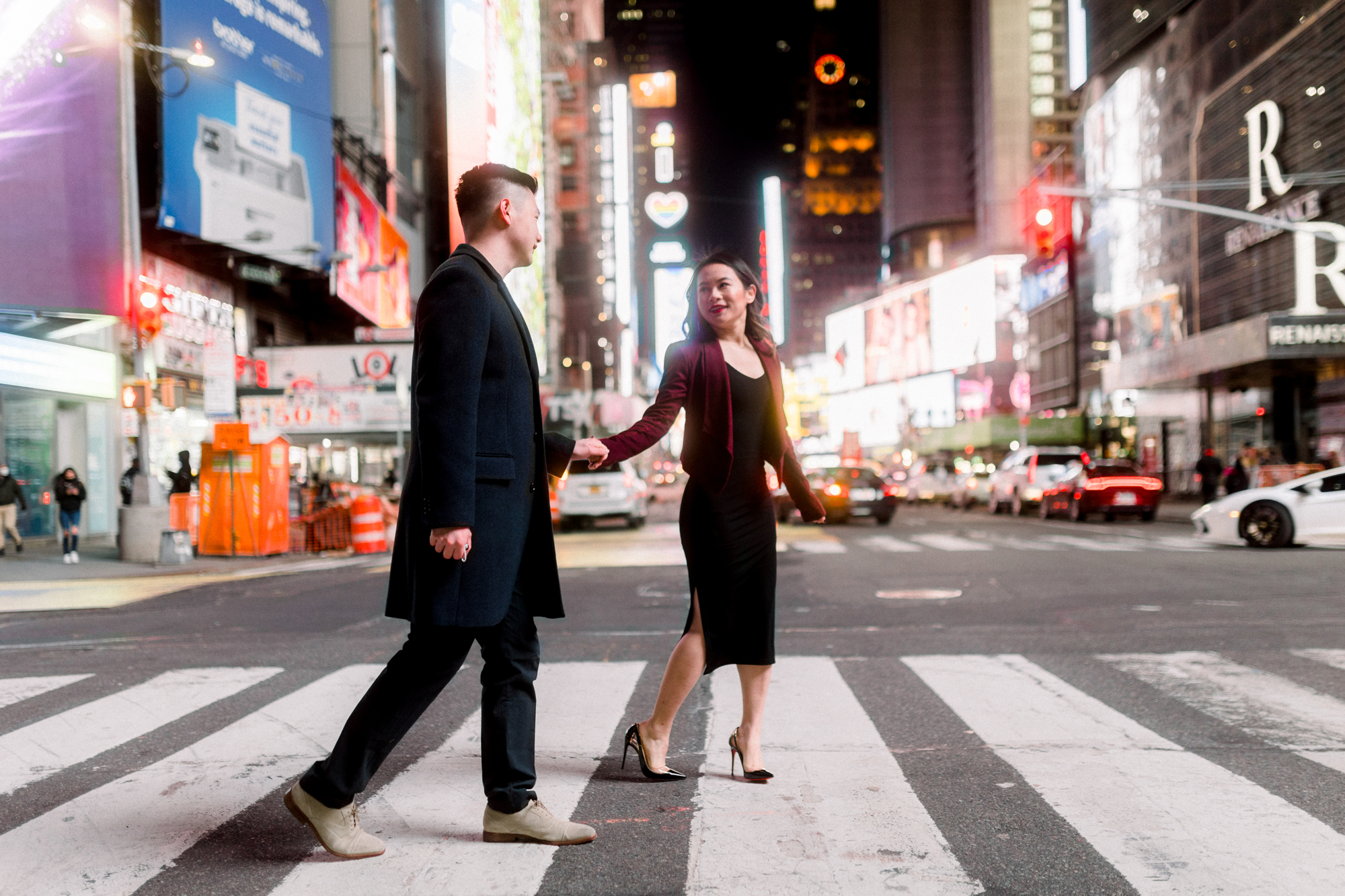 Joyful Nighttime Winter Engagement Photos in New York's Iconic Times Square