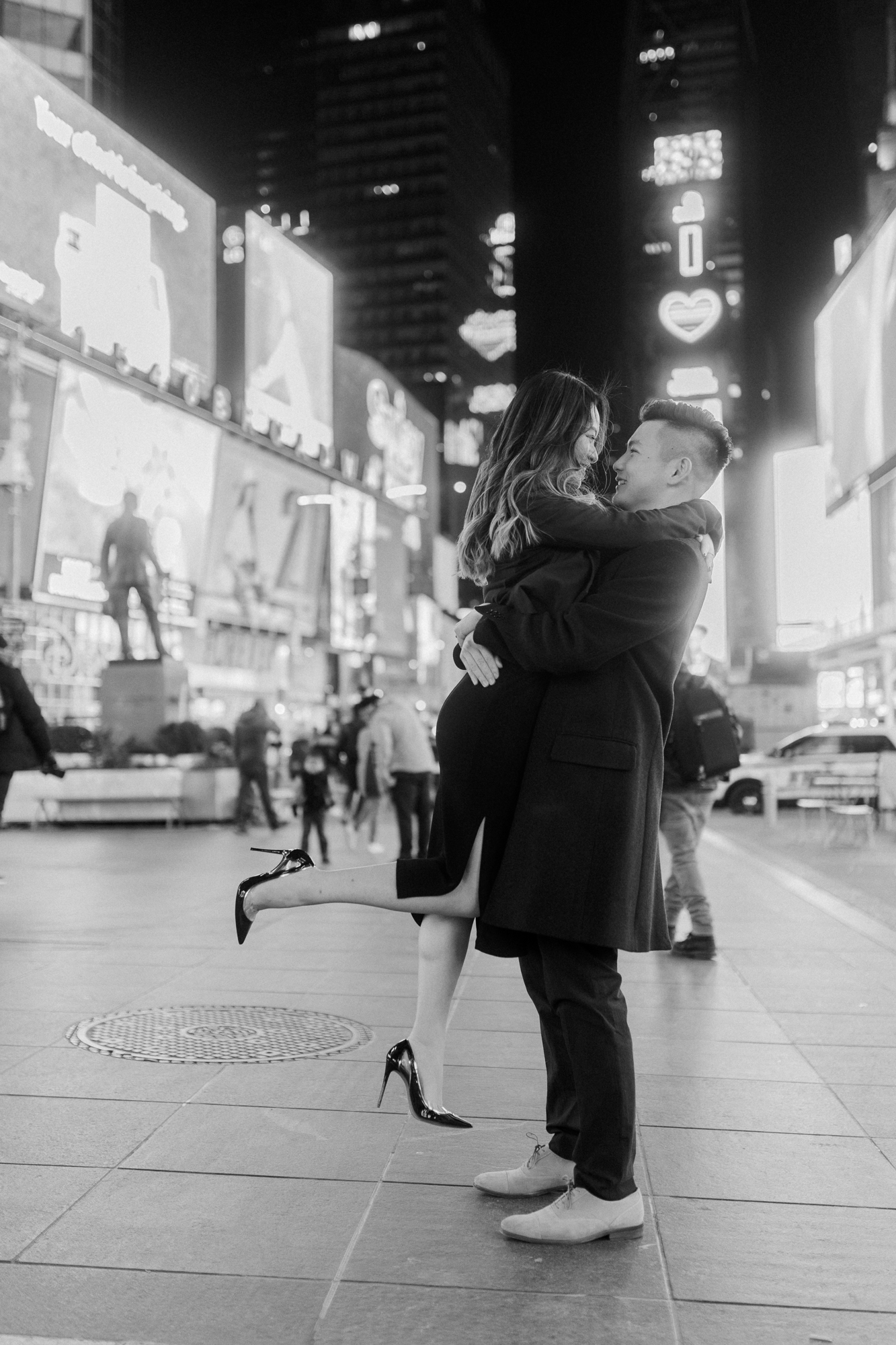 Breathtaking Nighttime Winter Engagement Photos in New York's Iconic Times Square