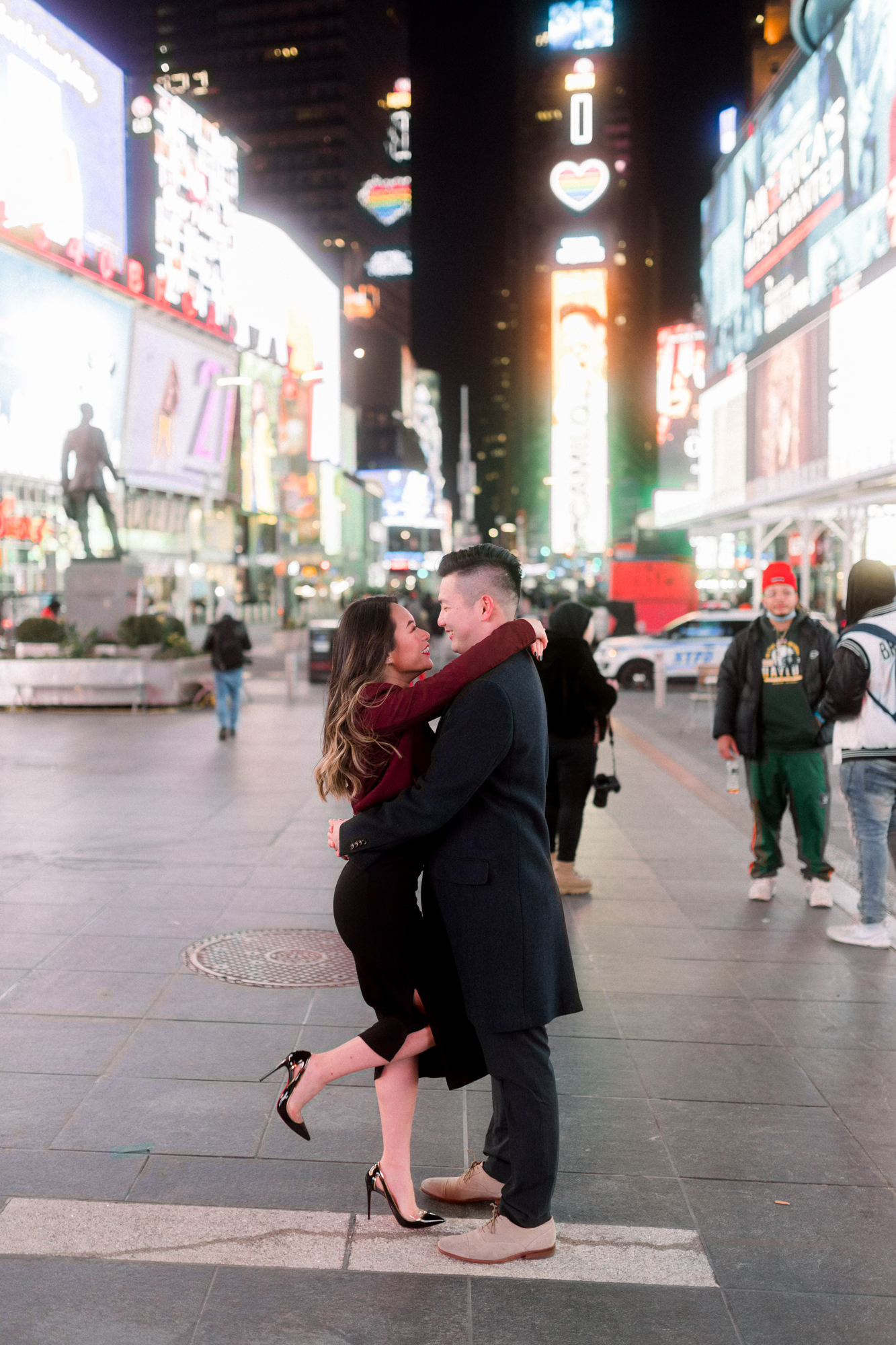 Sweet Nighttime Winter Engagement Photos in New York's Iconic Times Square