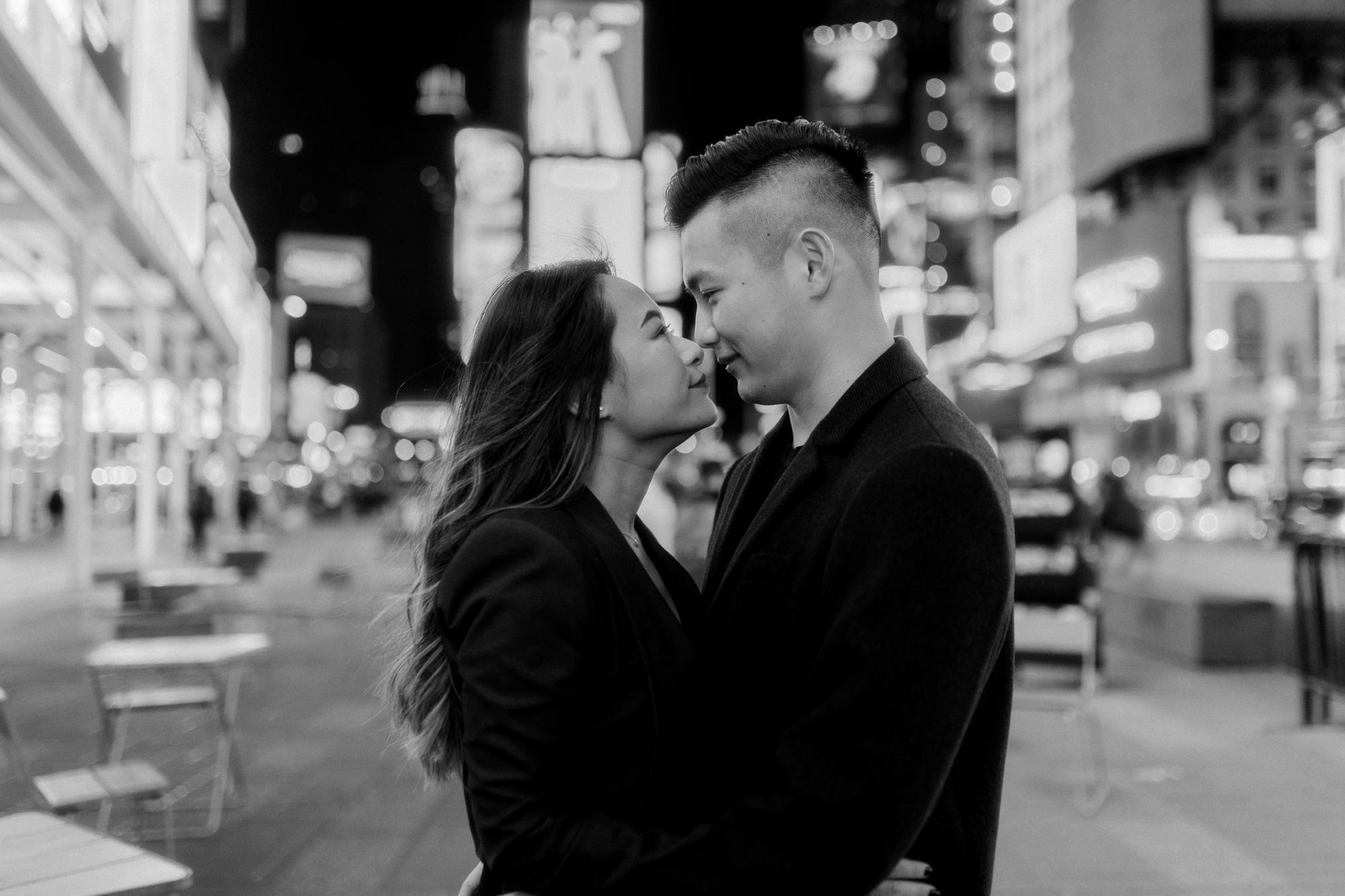 Black and White Nighttime Winter Engagement Photos in New York's Iconic Times Square