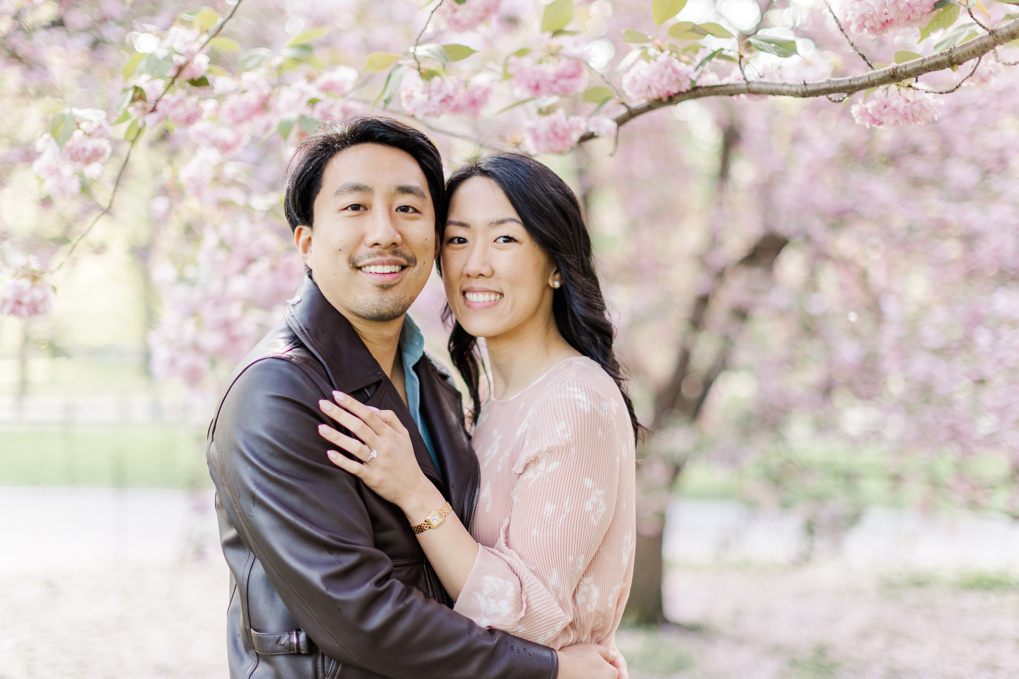 Playful Engagement Photos With Cherry Blossoms in NYC