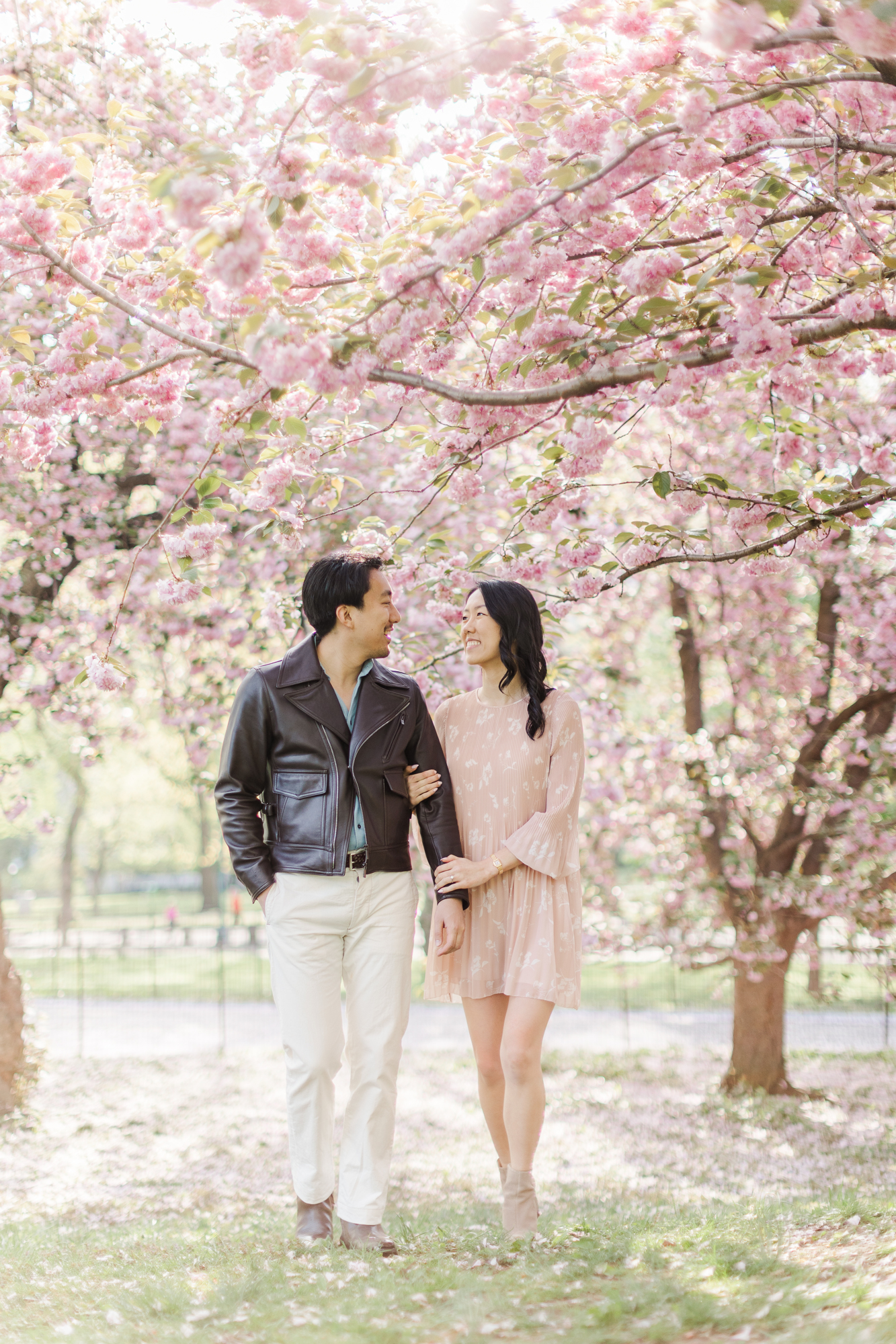 Cheerful Engagement Photos With Cherry Blossoms in NYC