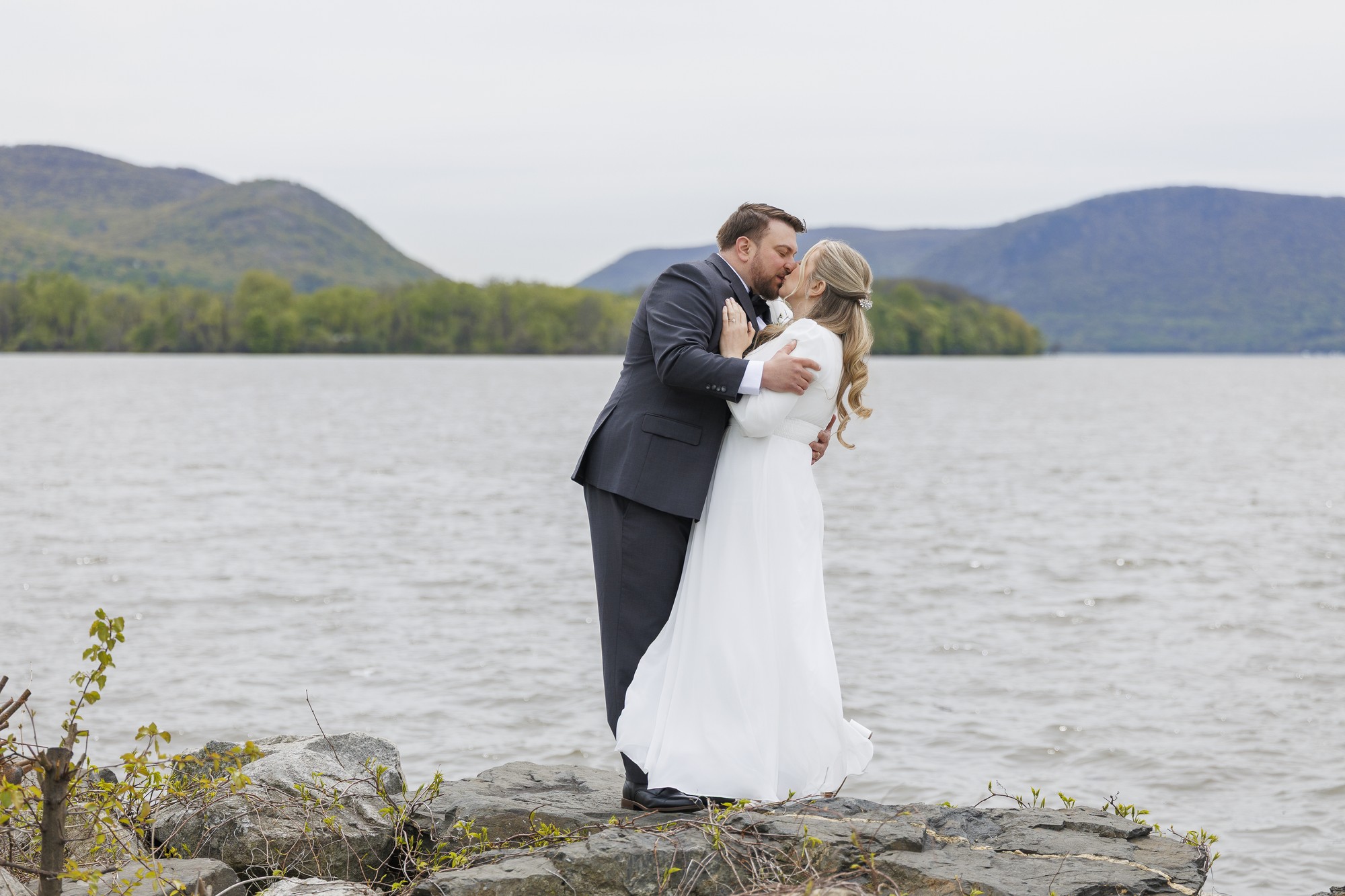 Bride and groom elope by lakeside with mountain backdrop, Hudson Valley wedding photography portrait session