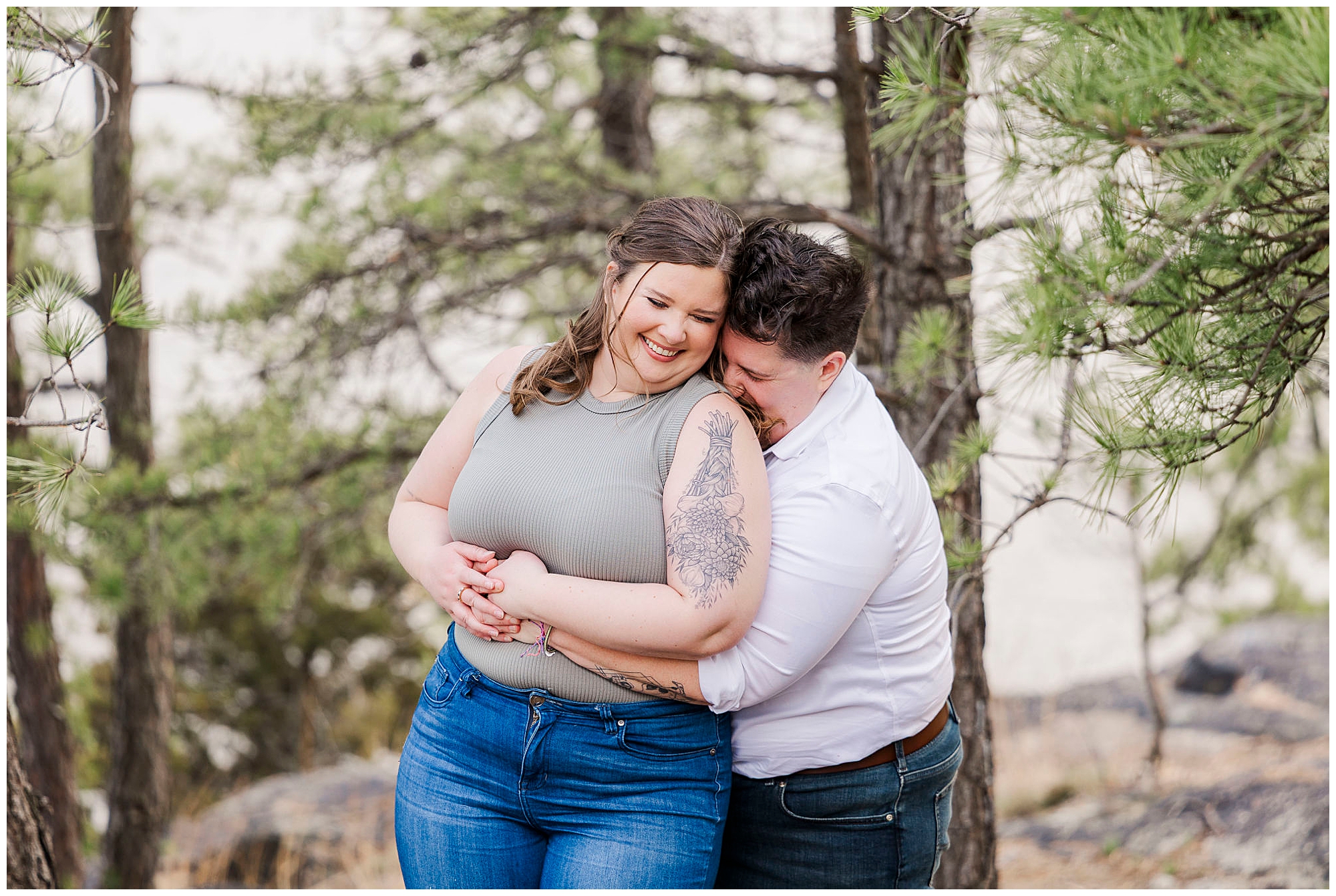 LGBTQ couple laughing and hugging during upstate ny engagement session