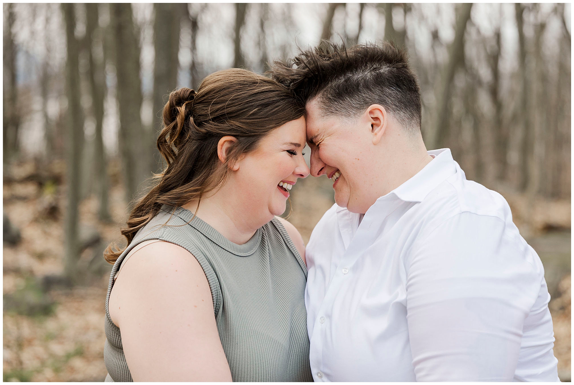 couple laughing on the forest path at Little Stony Point Park in early spring