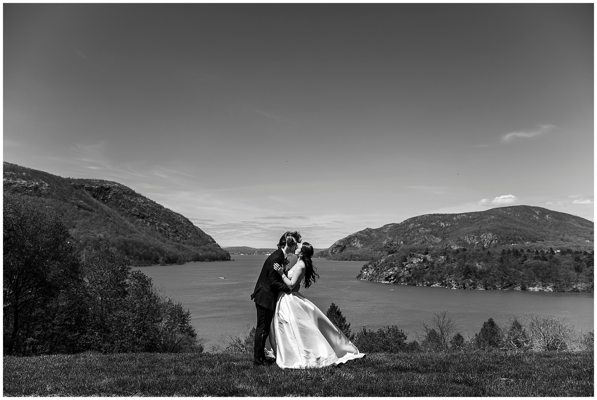 Black and white romantic portrait of bride and groom in the Hudson Valley landscape at The Thayer Hotel