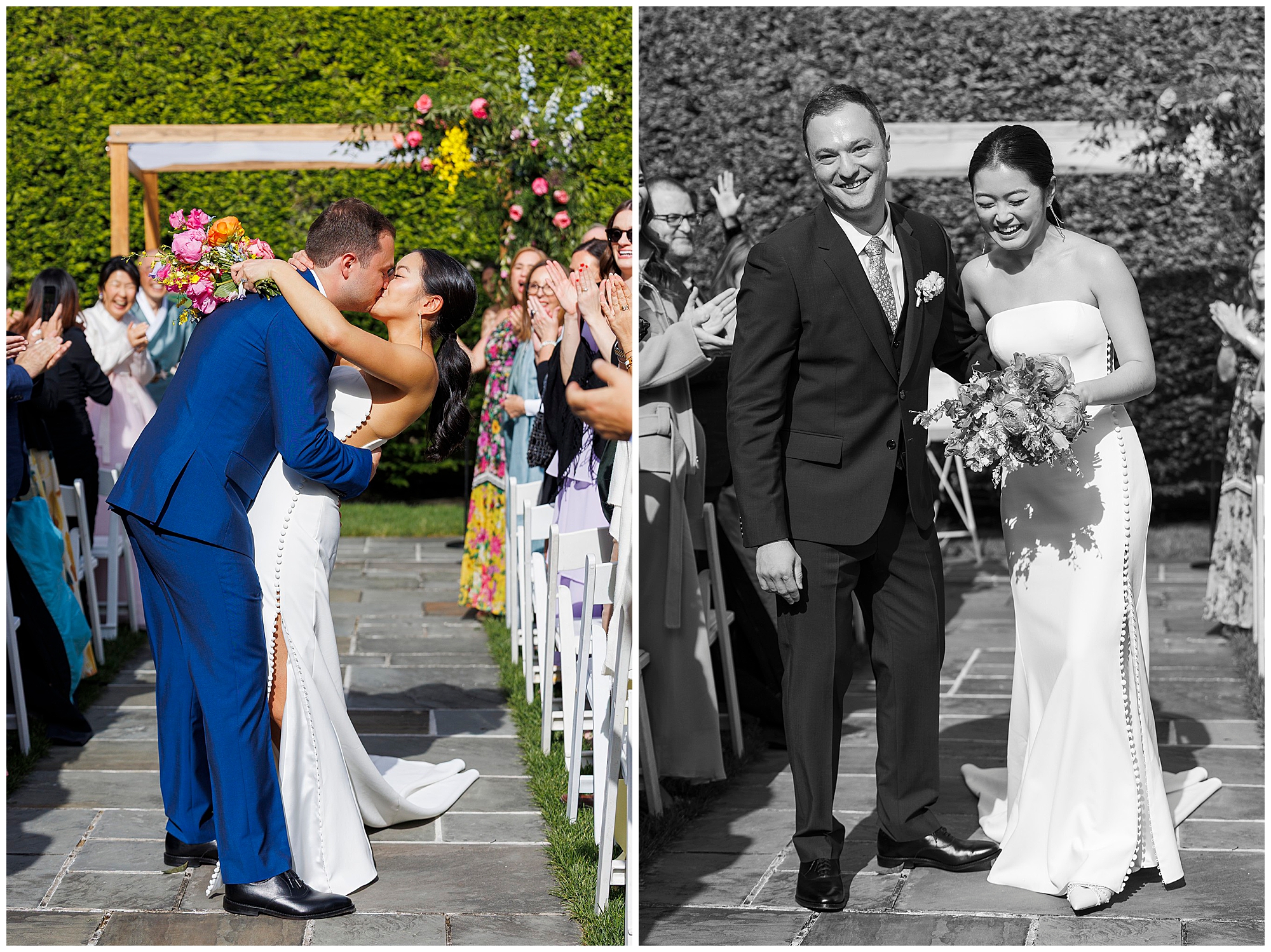 A bride in a white dress and a groom in a blue suit kiss at the end of the aisle during their roundhouse wedding, then walk back together smiling as guests applaud and cheer during an outdoor ceremony.