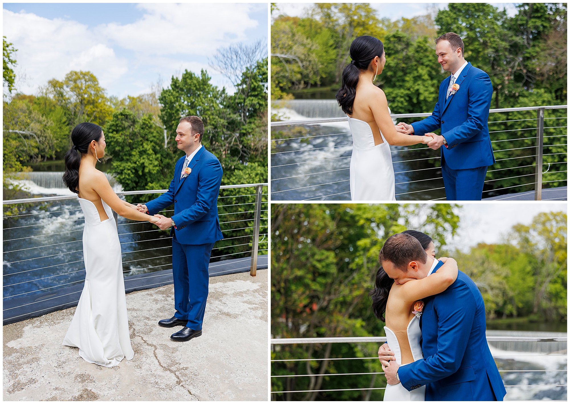 A bride in a white dress and a groom in a blue suit hold hands and embrace on a balcony at their roundhouse wedding, overlooking a river and trees as they share an emotional moment together.