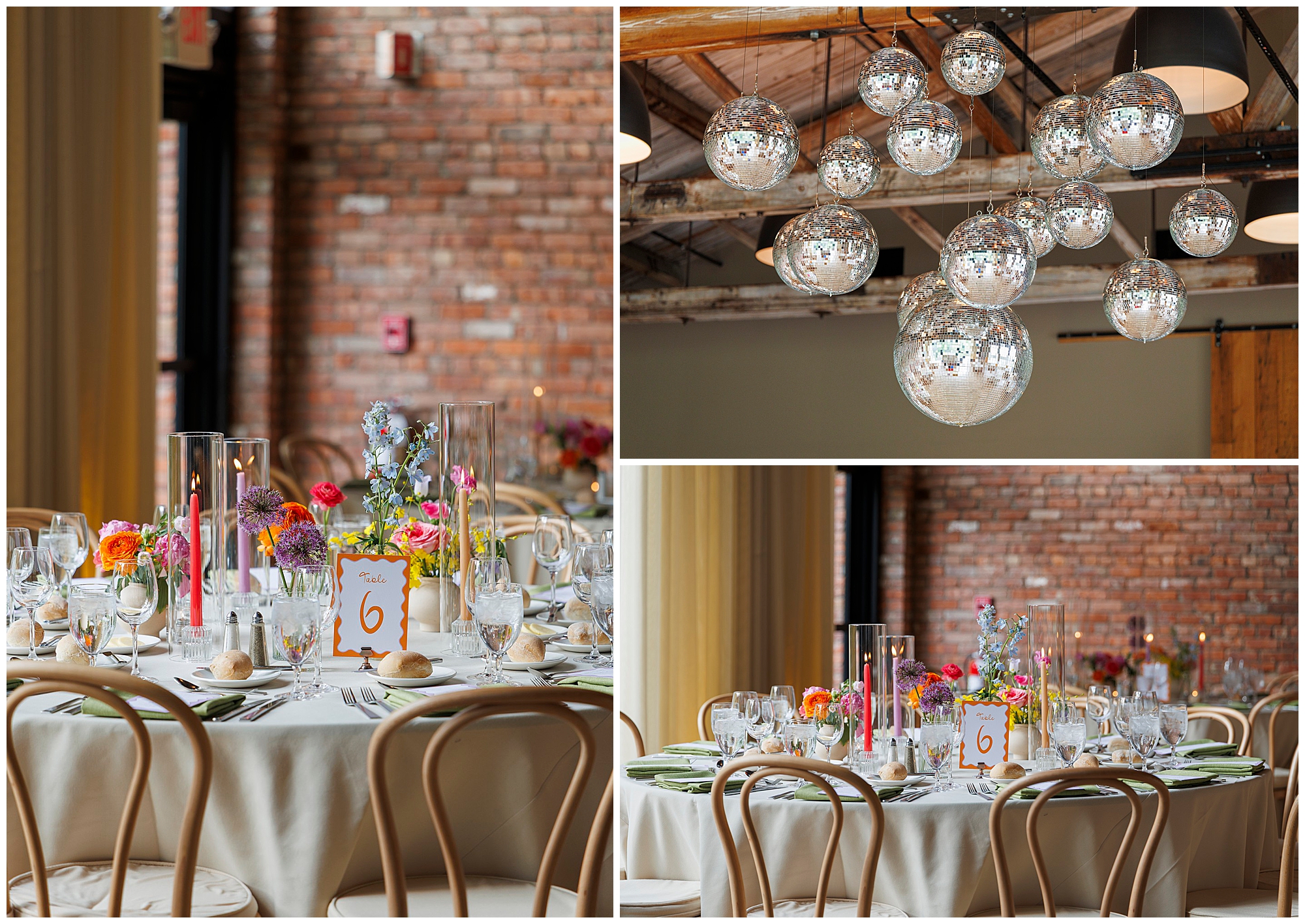 A modern roundhouse wedding setup with round tables adorned with flowers, candles, glassware, and table number cards, set beneath clusters of silver disco balls in a brick-walled venue with rustic wooden beams.