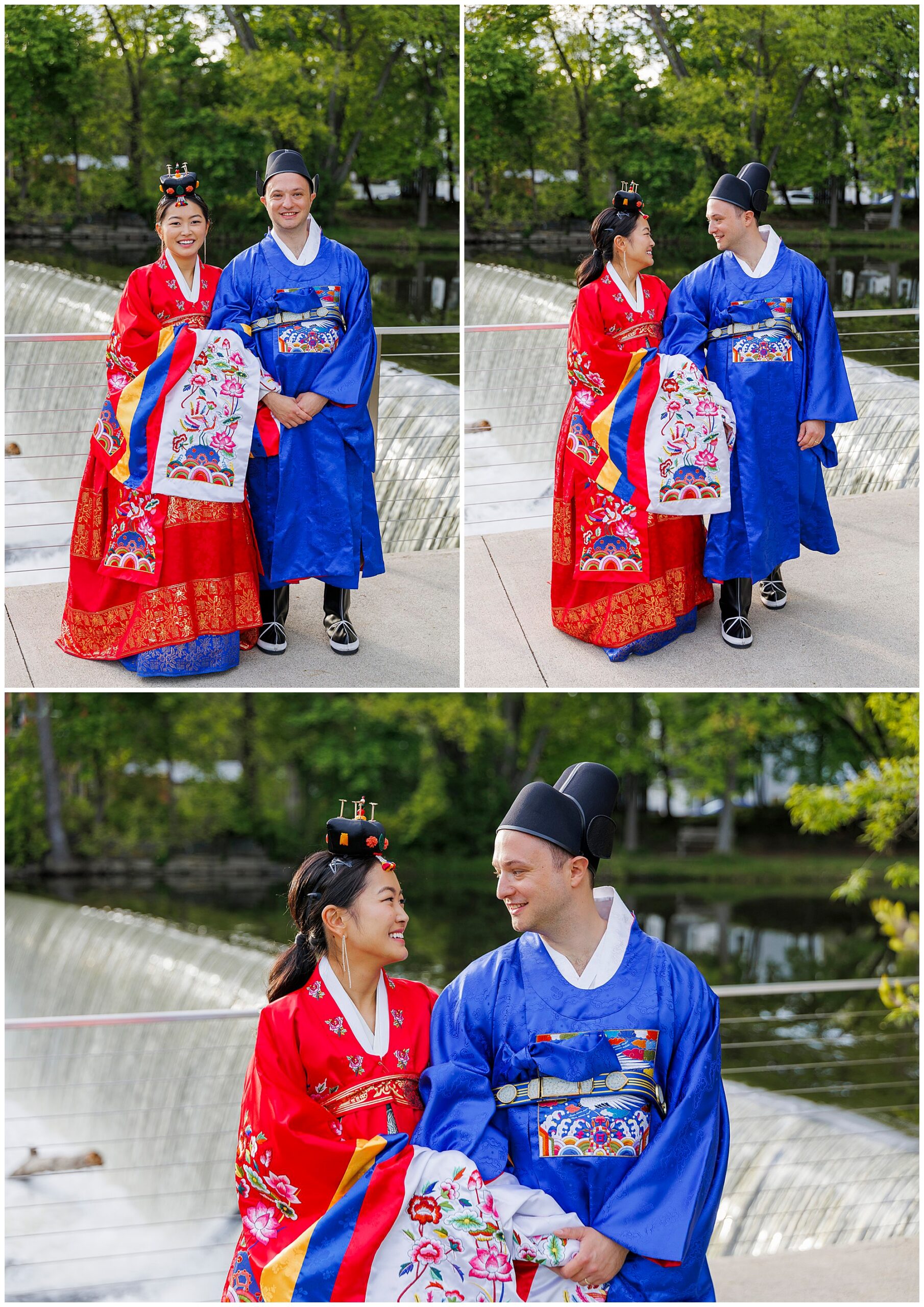 A couple dressed in traditional Korean hanbok, smiling near a river with trees behind them, celebrates their roundhouse wedding. The woman wears a red and gold hanbok; the man wears a blue and white hanbok.