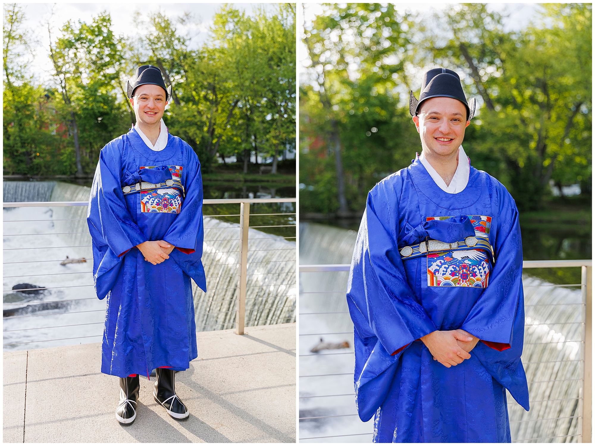 A person stands outdoors by a waterfall, wearing a traditional blue Asian robe and hat, smiling at the camera—perhaps attending a roundhouse wedding. Green trees are in the background on a sunny day.