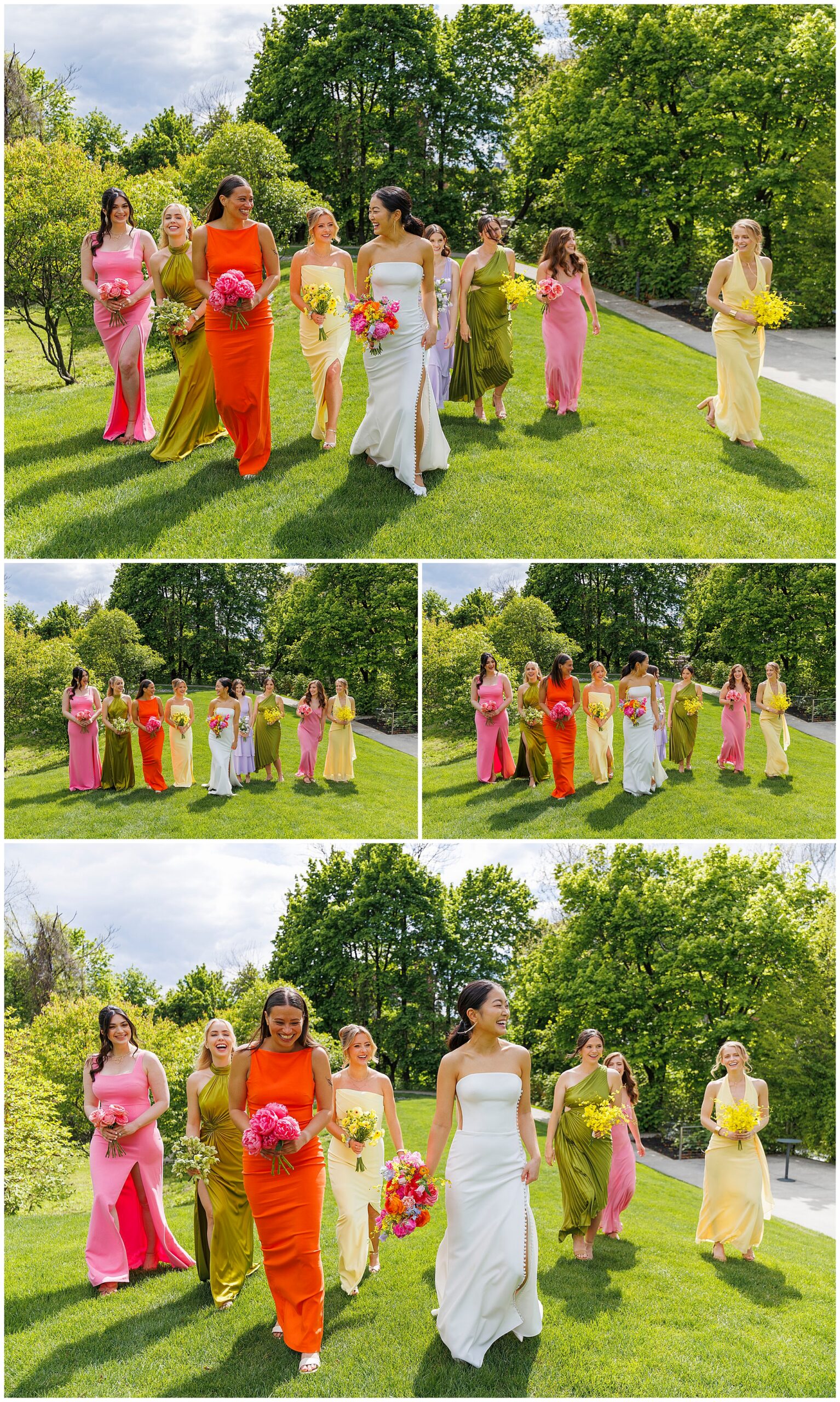 A bride in a white dress walks outdoors on green grass with six bridesmaids in bright, colorful dresses. They smile and chat in a lush, sunny park at their roundhouse wedding, with trees providing a picturesque backdrop.