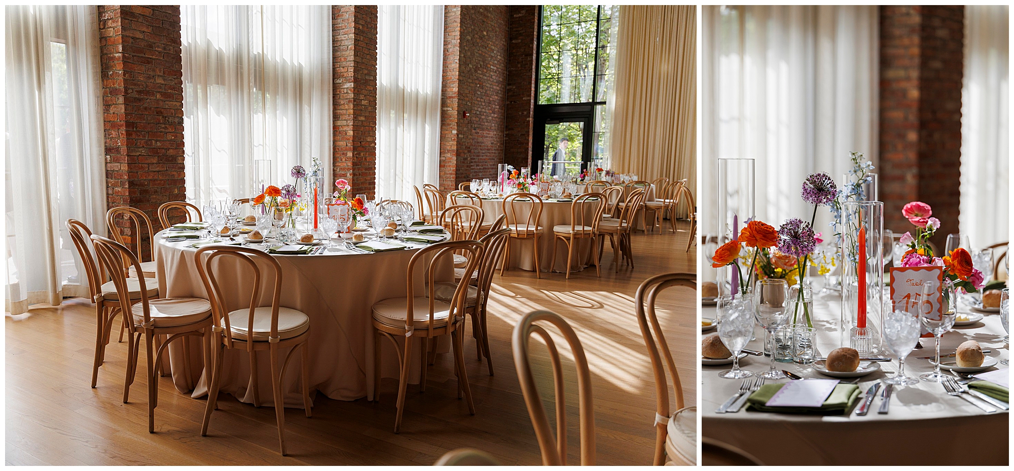 Elegant event space set for a roundhouse wedding, with round tables adorned in beige tablecloths, wooden chairs, and vibrant floral centerpieces. Large windows and brick walls fill the room with natural light.