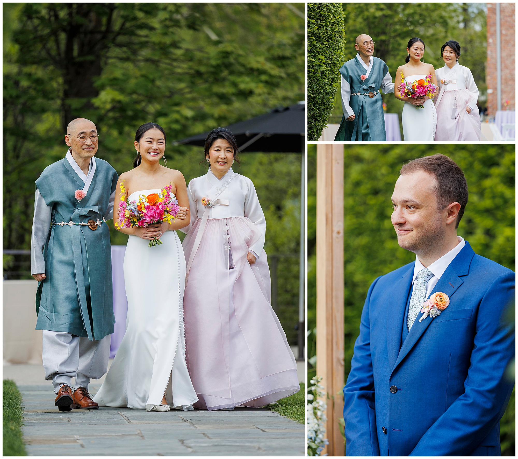 A bride in a white dress walks with her parents in traditional Korean hanbok at a roundhouse wedding; the groom in a blue suit smiles as he watches them approach outdoors.