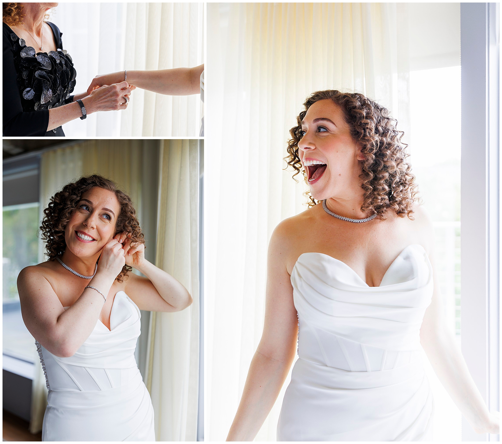 A joyful bride with curly hair in a white strapless wedding dress smiles as she puts on earrings, receives help with a bracelet, and stands by a window with sheer curtains, glowing with excitement at her wedding at the Roundhouse.