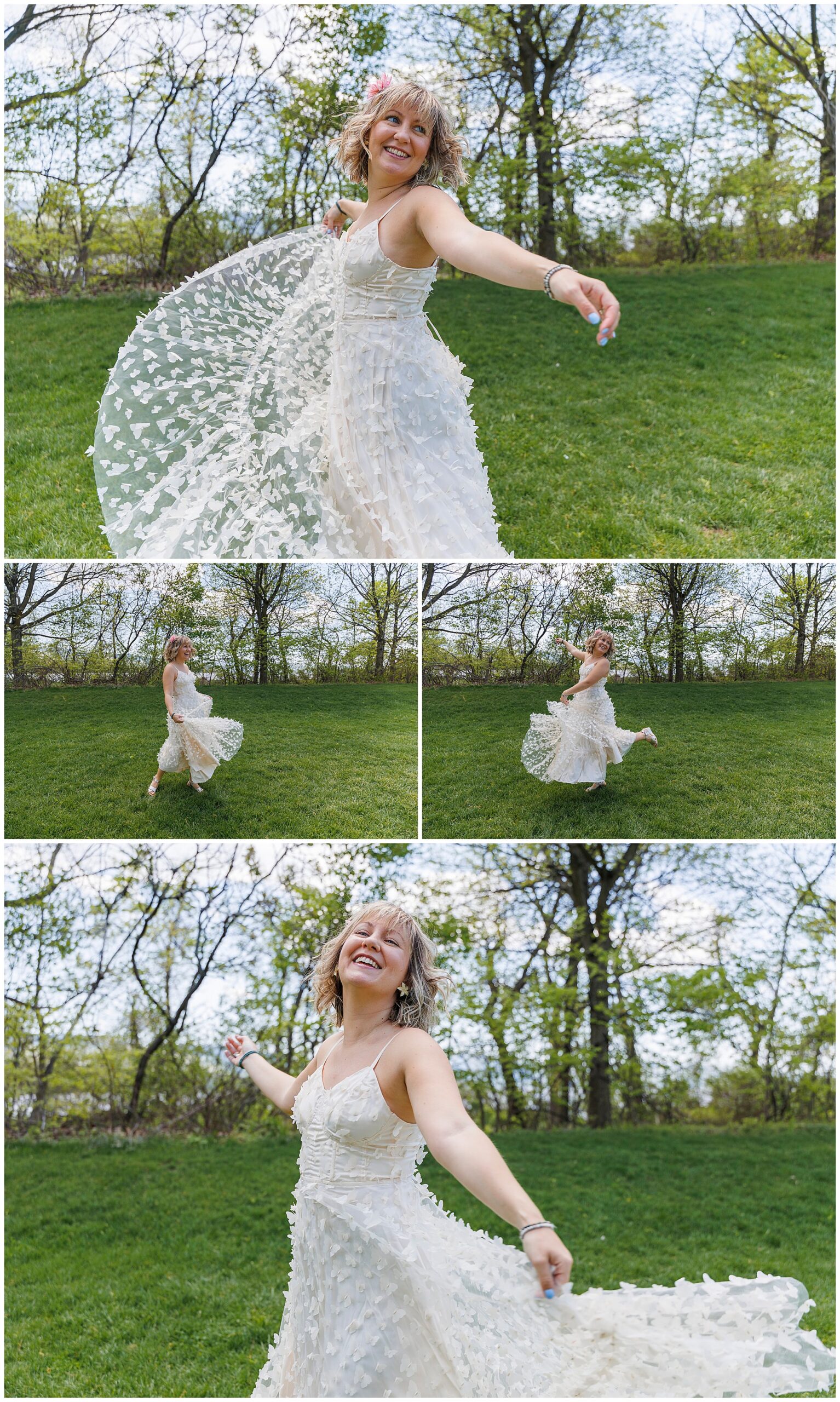 A joyful woman in a white, flowy, flower-appliqué dress twirls on green grass outside Beacon courthouse, smiling brightly with the trees and blue sky in the background—capturing the spirit of an elopement.