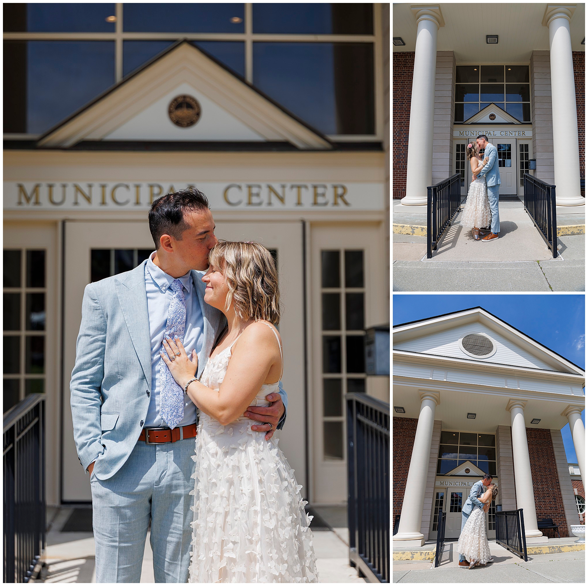 A couple in wedding attire embraces and kisses outside a building labeled Municipal Center. They pose happily together on the steps in front of tall columns under a sunny sky.