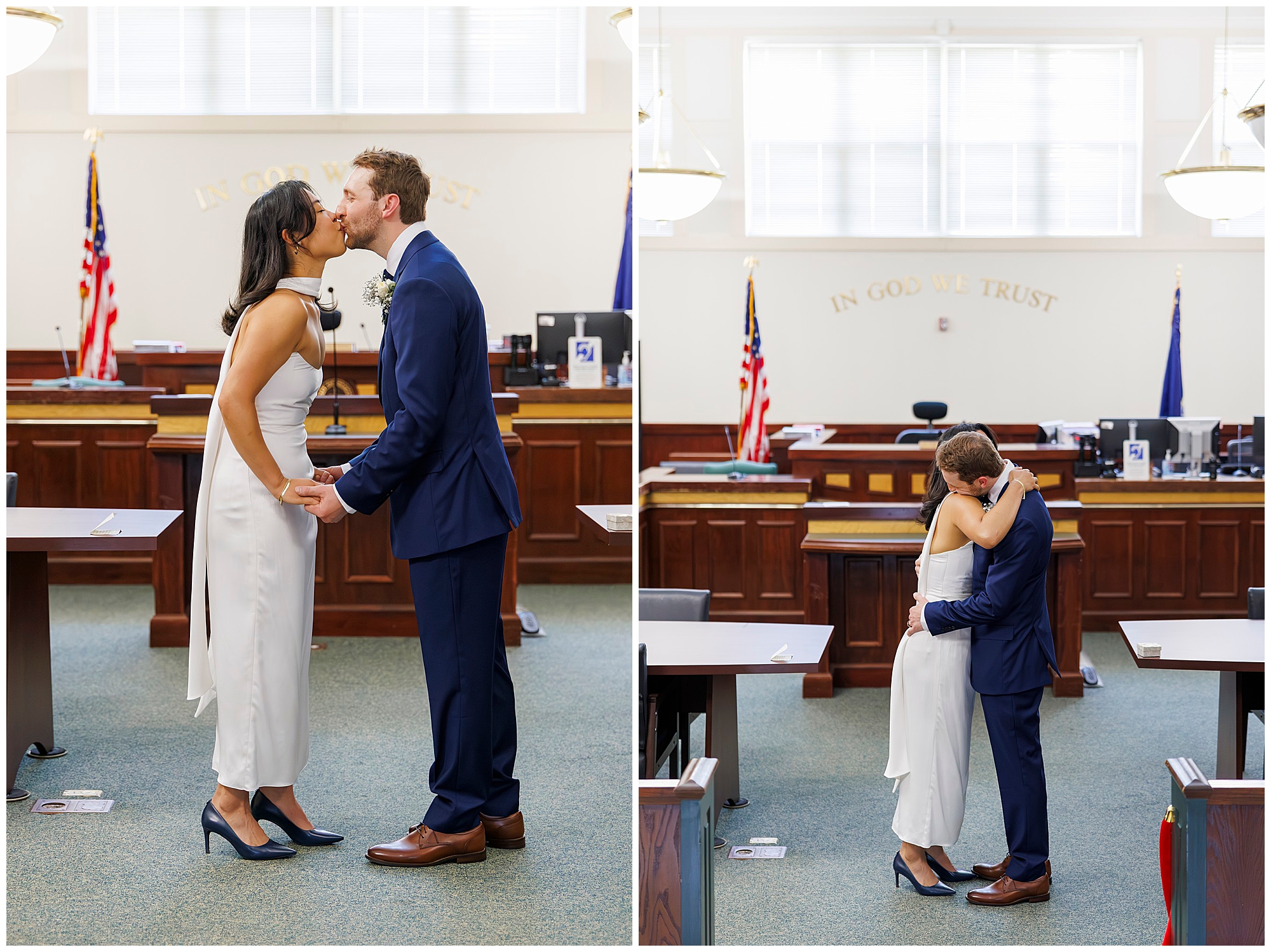 A couple dressed formally kisses and embraces in Beacon City Hall, standing before a judge’s bench with American flags and the words In God We Trust—a classic city hall elopement moment.