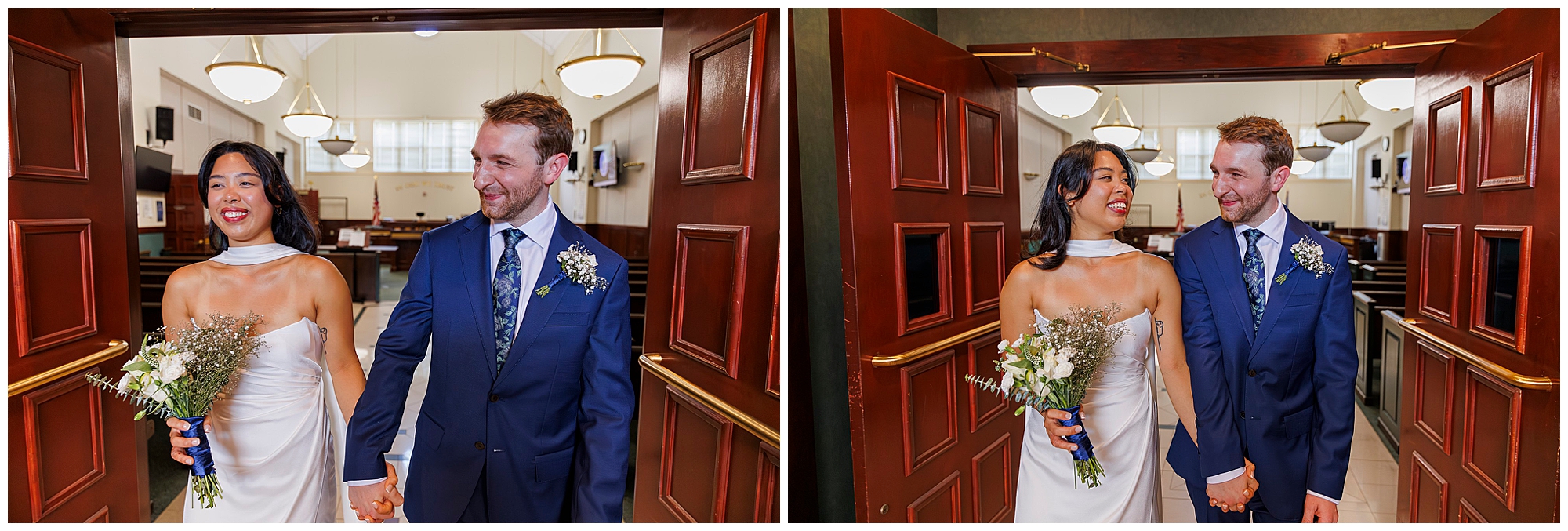 A bride in a white dress and a groom in a blue suit enter Beacon City Hall, smiling and holding hands. The bride holds a bouquet of flowers. Both look happy and share a joyful elopement moment in the well-lit room.