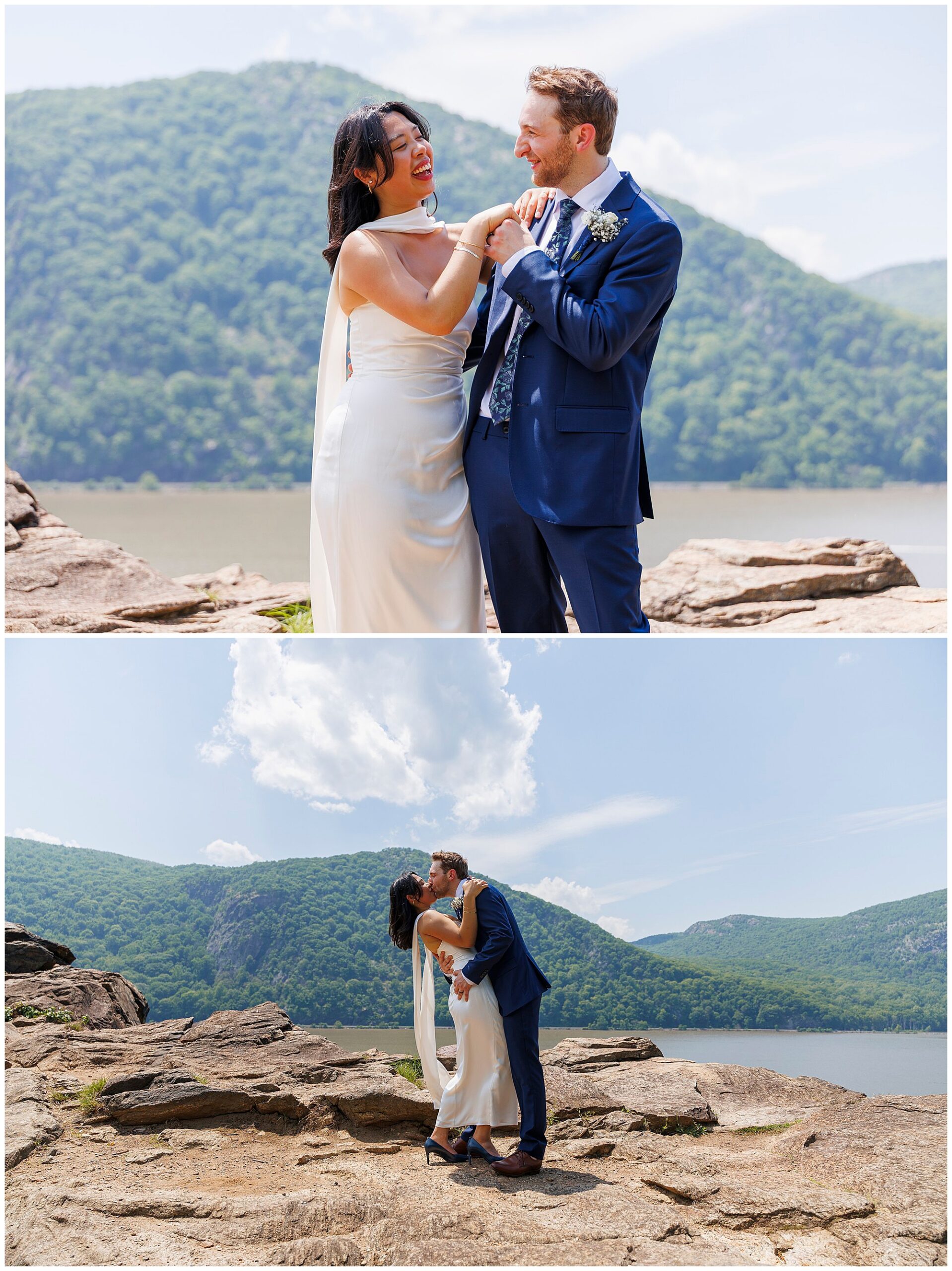 A bride in a white dress and a groom in a navy suit share joyful moments and a kiss on rocky terrain by a lake, as if celebrating their Beacon City Hall elopement, with green mountains and blue sky in the background.