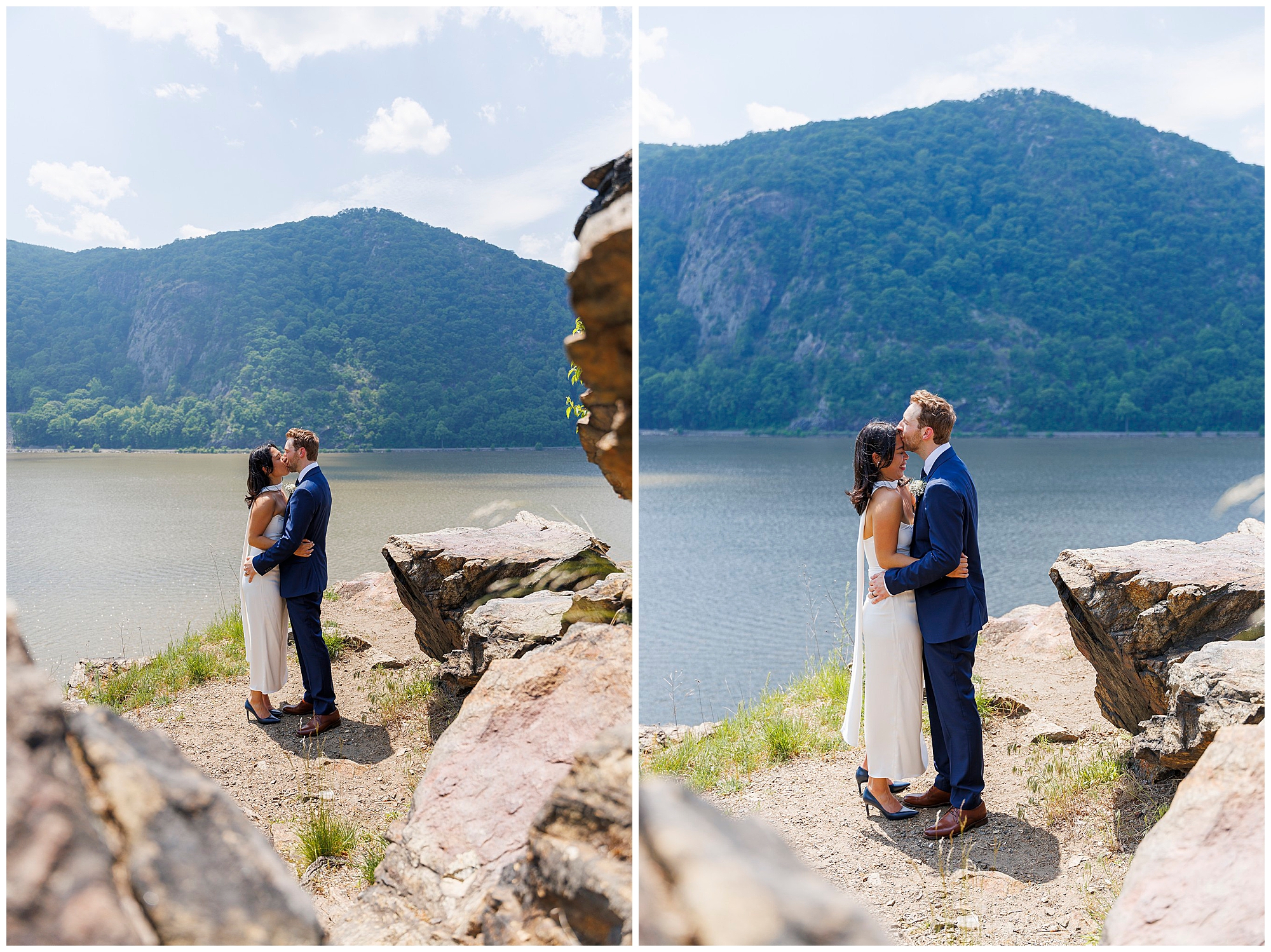 A couple stands on a rocky cliff by a lake, embraced and sharing a kiss, reminiscent of a Beacon City Hall elopement, with green mountains and a partly cloudy sky in the background.