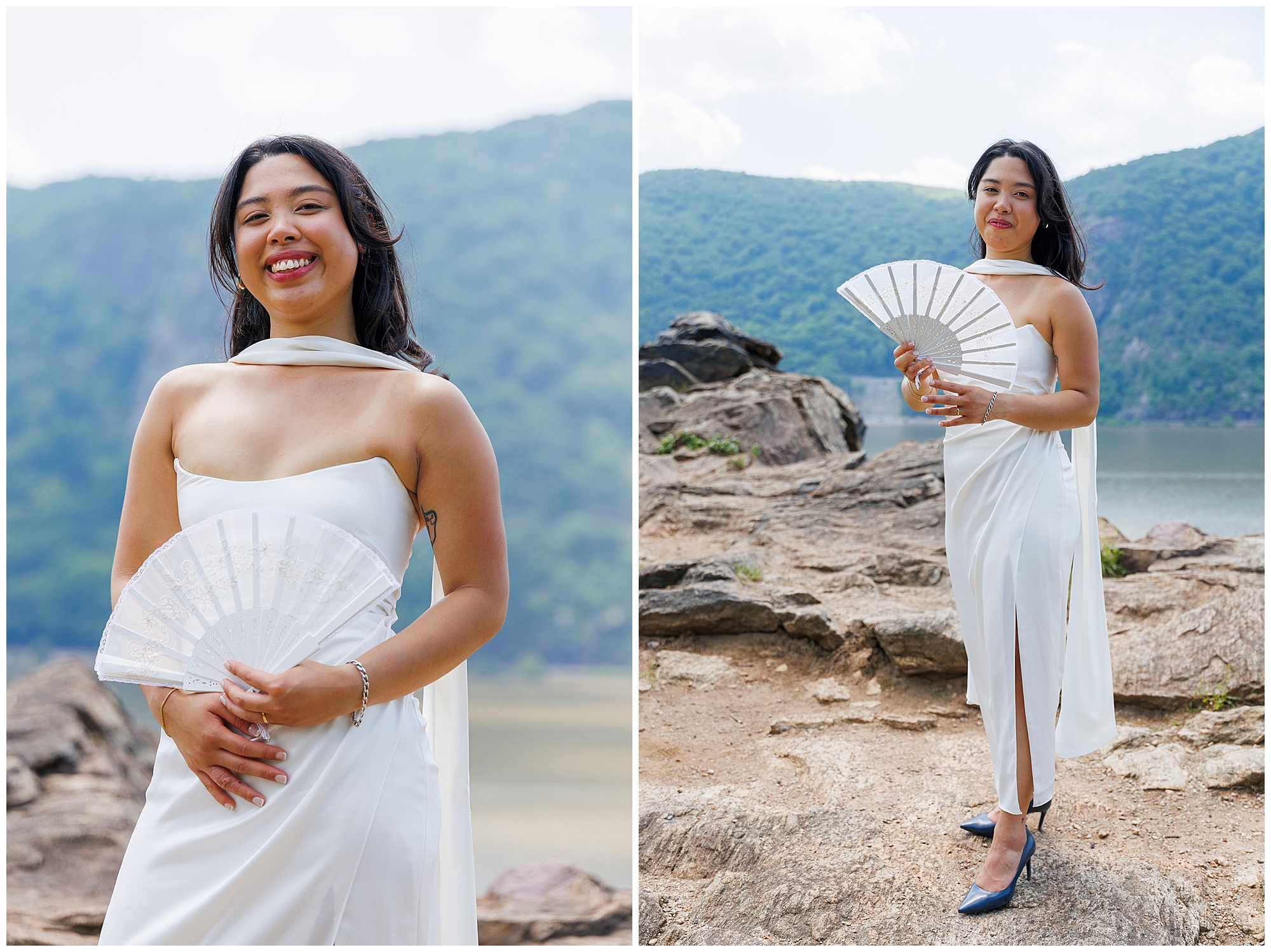 A woman in a white dress stands outdoors on rocky terrain, holding a white folding fan, reminiscent of a Beacon City Hall elopement. Mountains and a body of water are visible in the background under a partly cloudy sky.