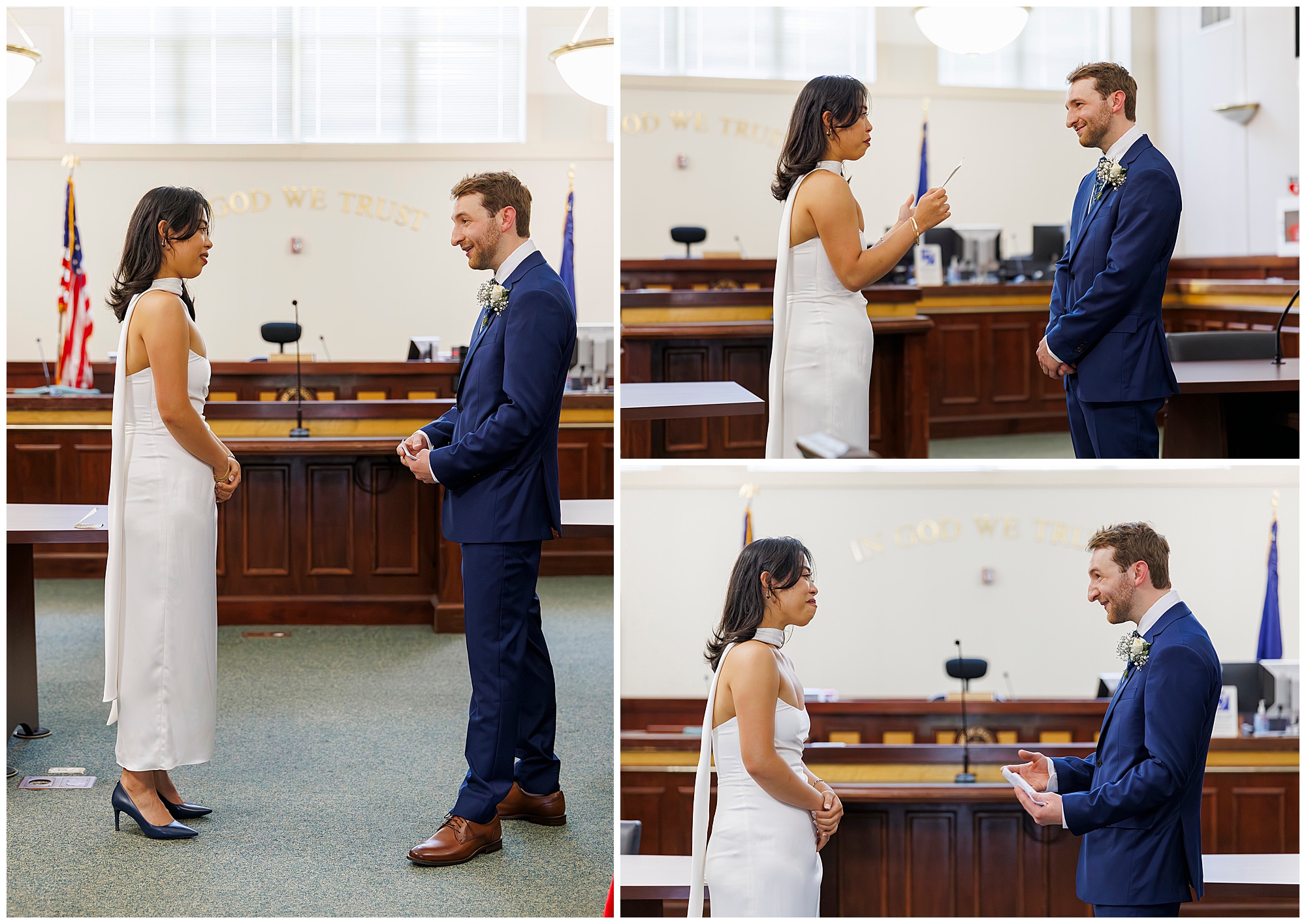 A couple in formal attire exchanges vows during their Beacon City Hall elopement. The woman wears a white dress and the man a blue suit, smiling at each other as "In God We Trust" is visible behind them.