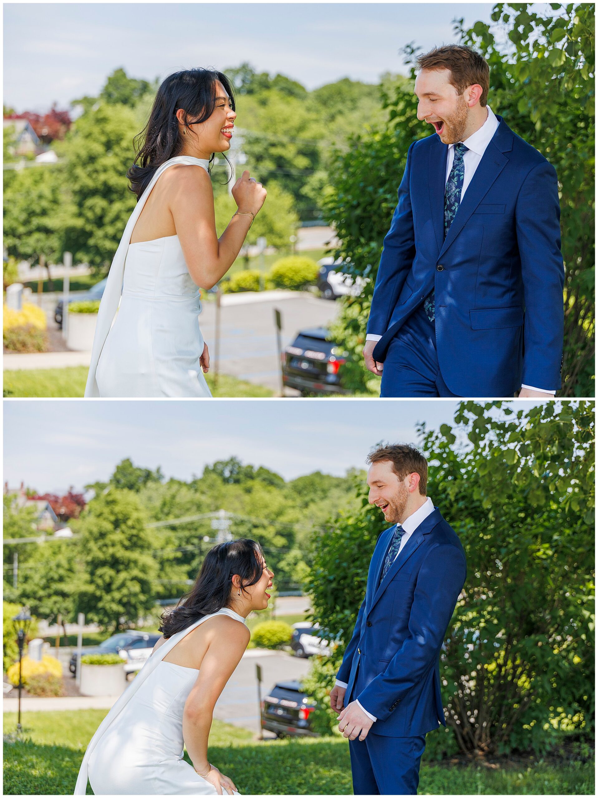 Two people in formal attire, a woman in a white dress and a man in a blue suit, laugh and react joyfully to seeing each other outdoors on their sunny Beacon City Hall elopement, surrounded by greenery and parked cars.