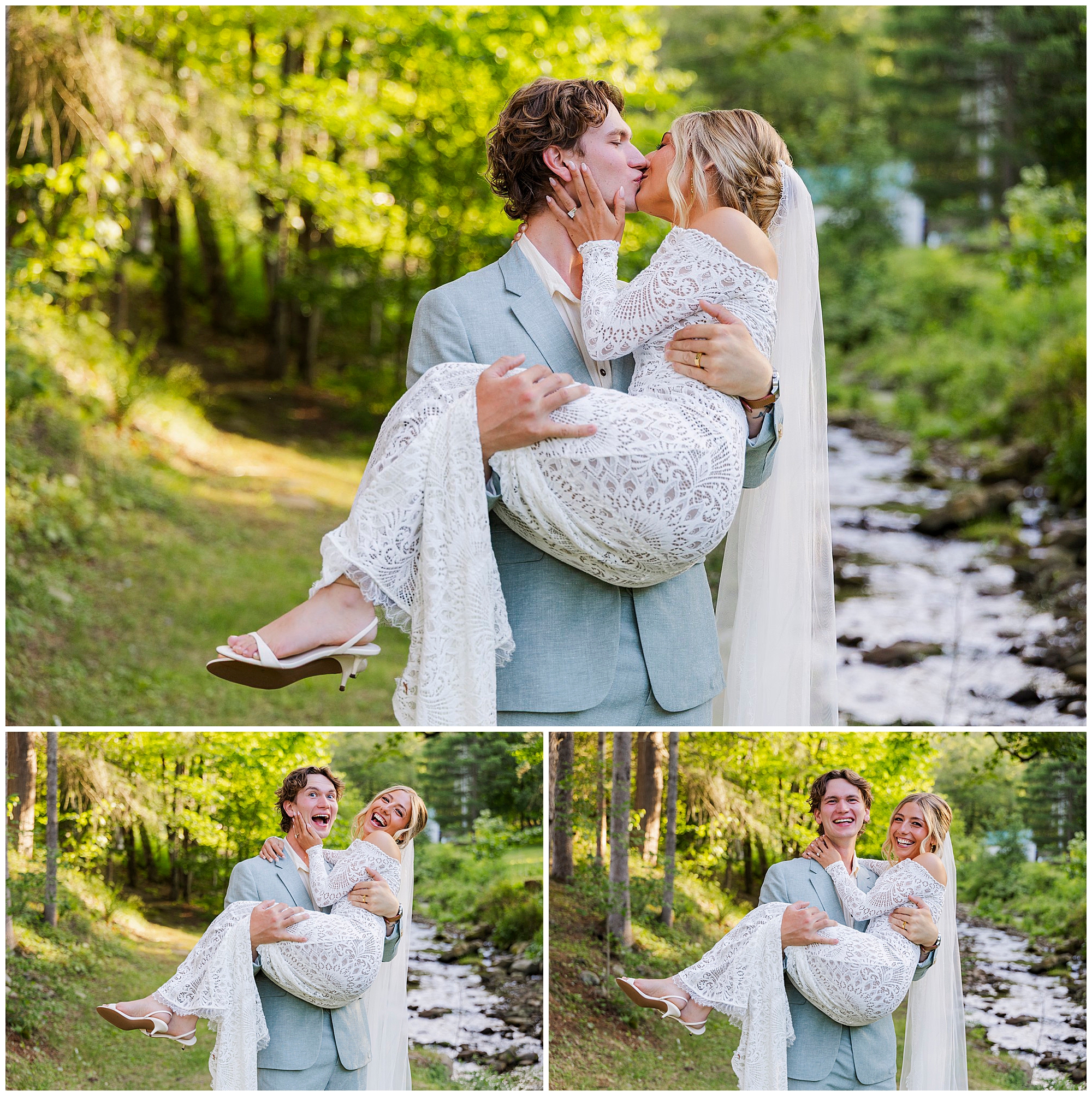 A groom in a light suit joyfully carries his smiling bride in a lace dress and veil through a lush, sunlit outdoor setting by a stream; both look happy and in love.