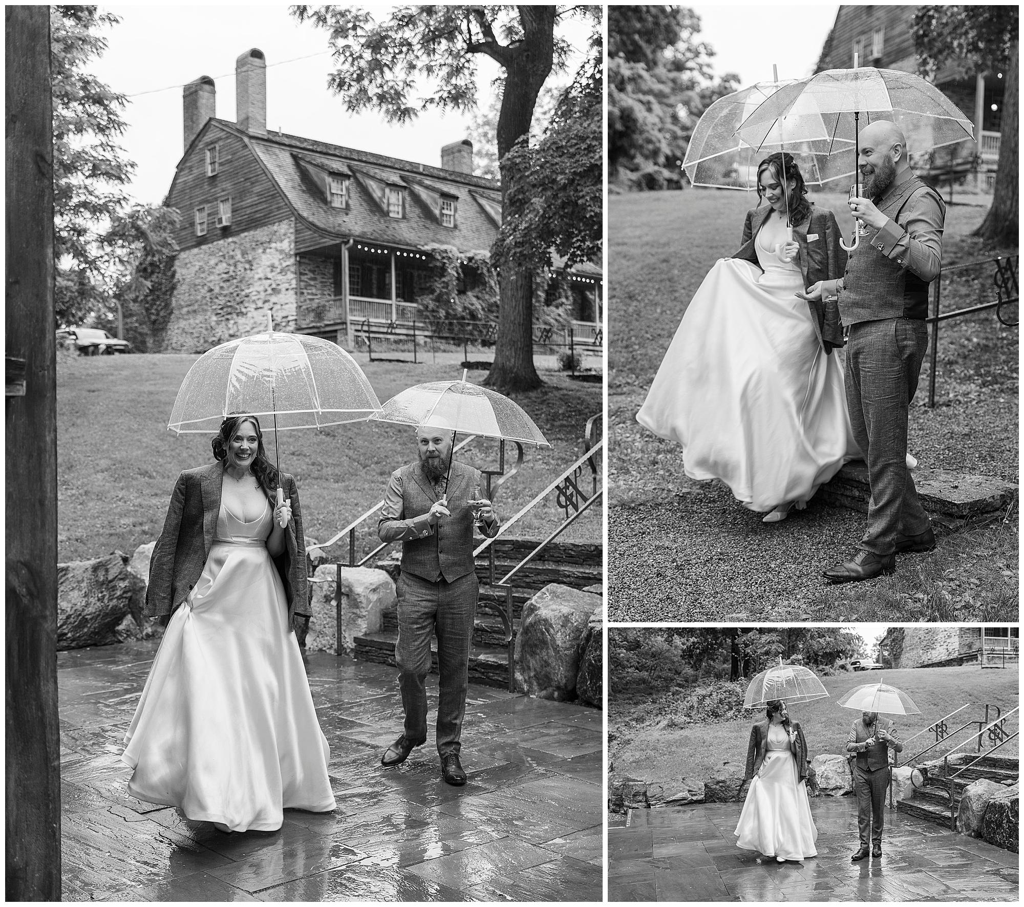 A bride and groom walk outside in the rain, sharing a clear umbrella. The bride wears a gown with a jacket, while the groom is in a vest and trousers. They smile and laugh near a rustic stone building. Black and white photos.