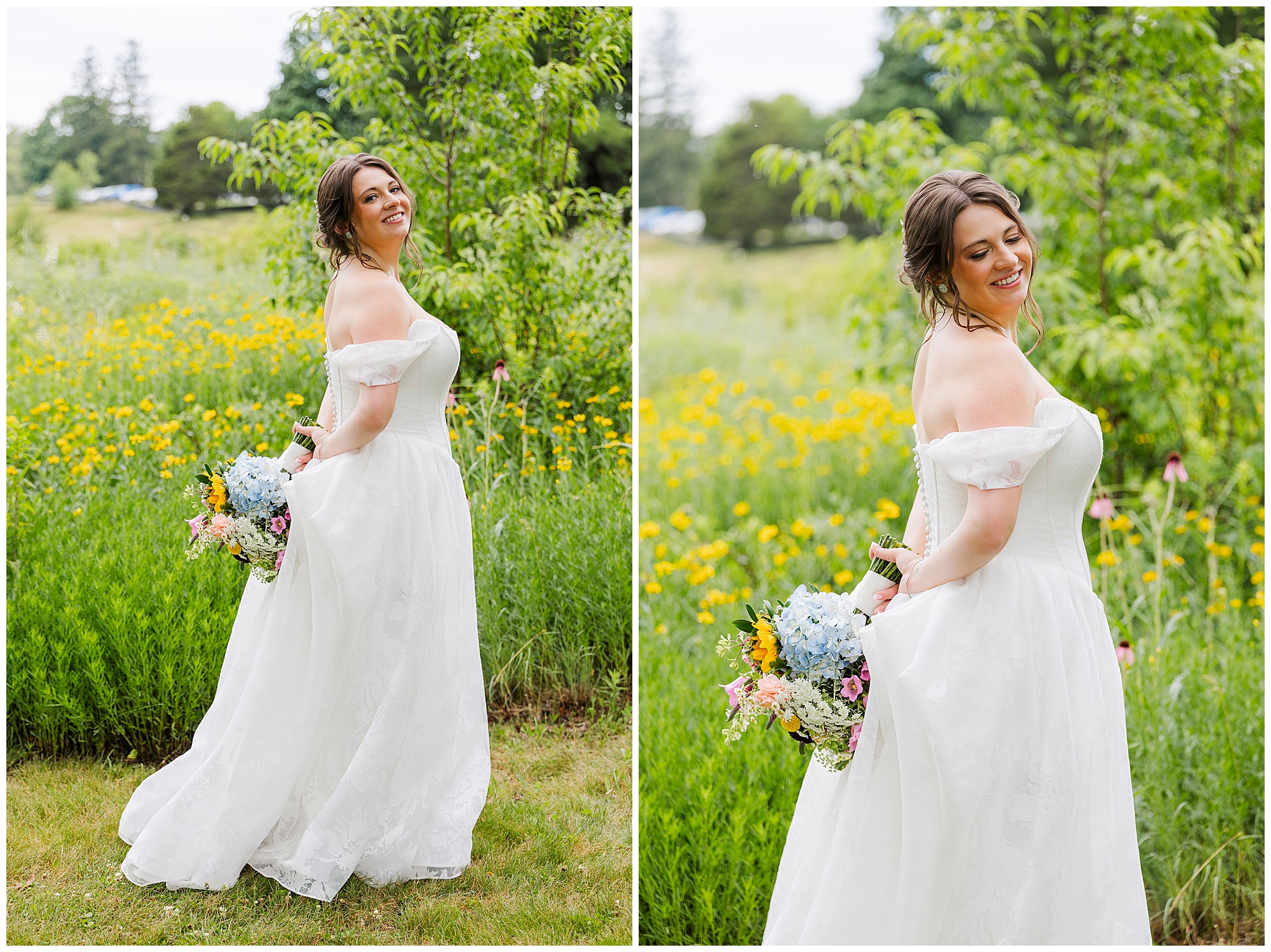 A bride in an off-the-shoulder white gown holds a bouquet of flowers and smiles, standing in a green field dotted with yellow wildflowers and trees, capturing the charm of a summer garrison wedding.