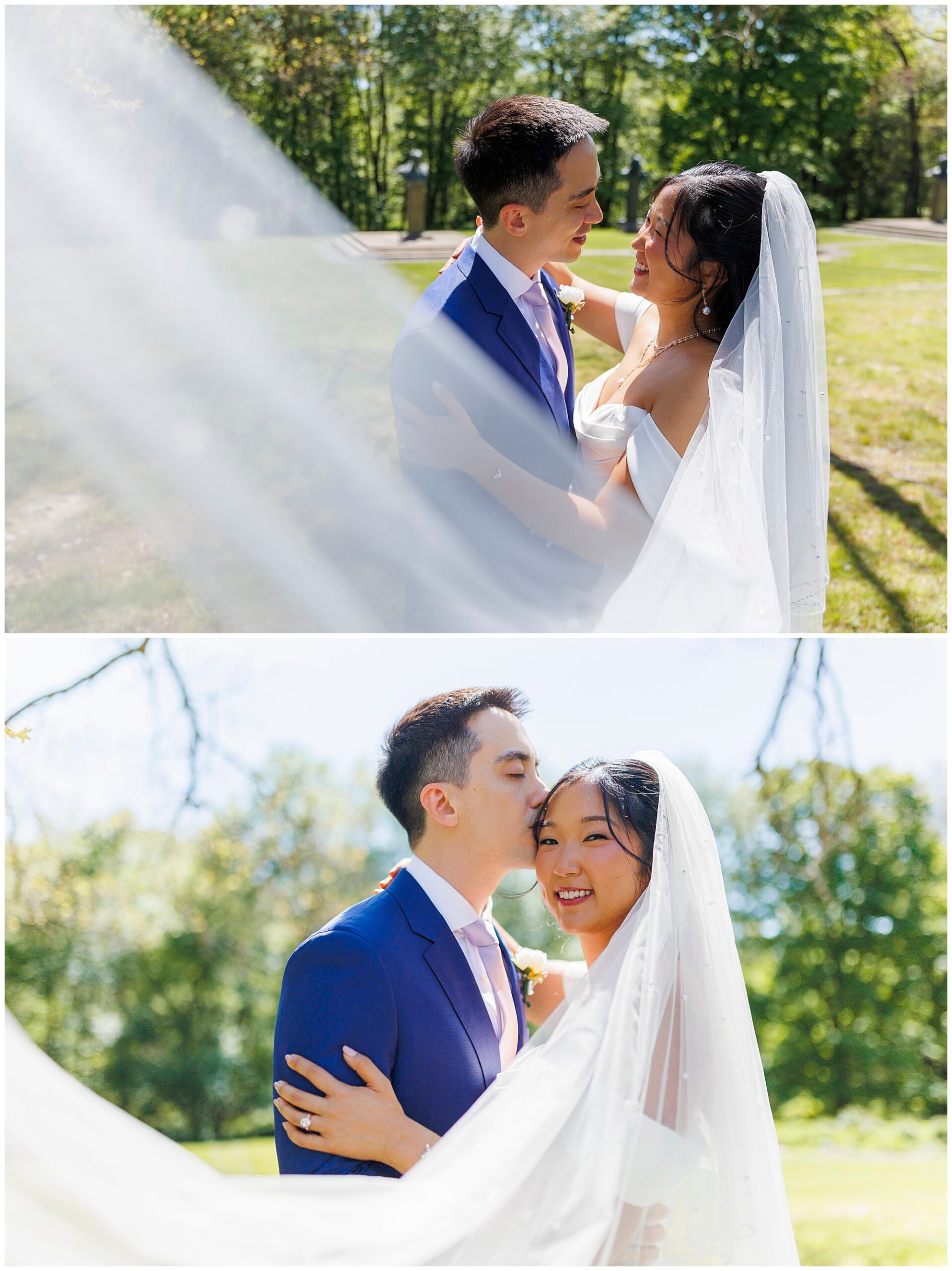A bride and groom embrace outdoors on a sunny day during their wedding at Arrow Park. The bride wears a white dress and veil, and the groom in a blue suit smiles at her, surrounded by lush greenery.