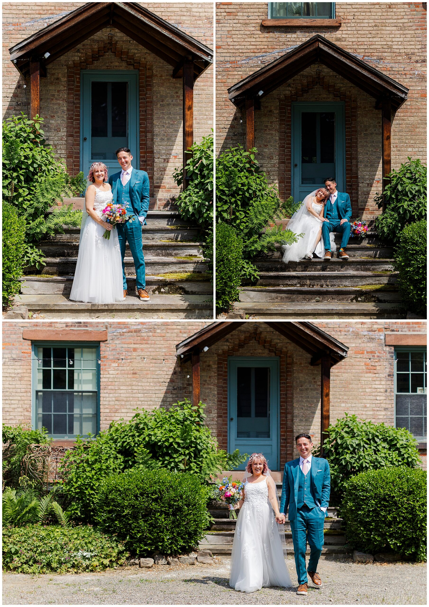 A bride in a white dress and a groom in a teal suit pose together outside a brick building with a blue door, smiling and sitting or standing on stone steps amid greenery during their wedding at the yard, holding a colorful bouquet.