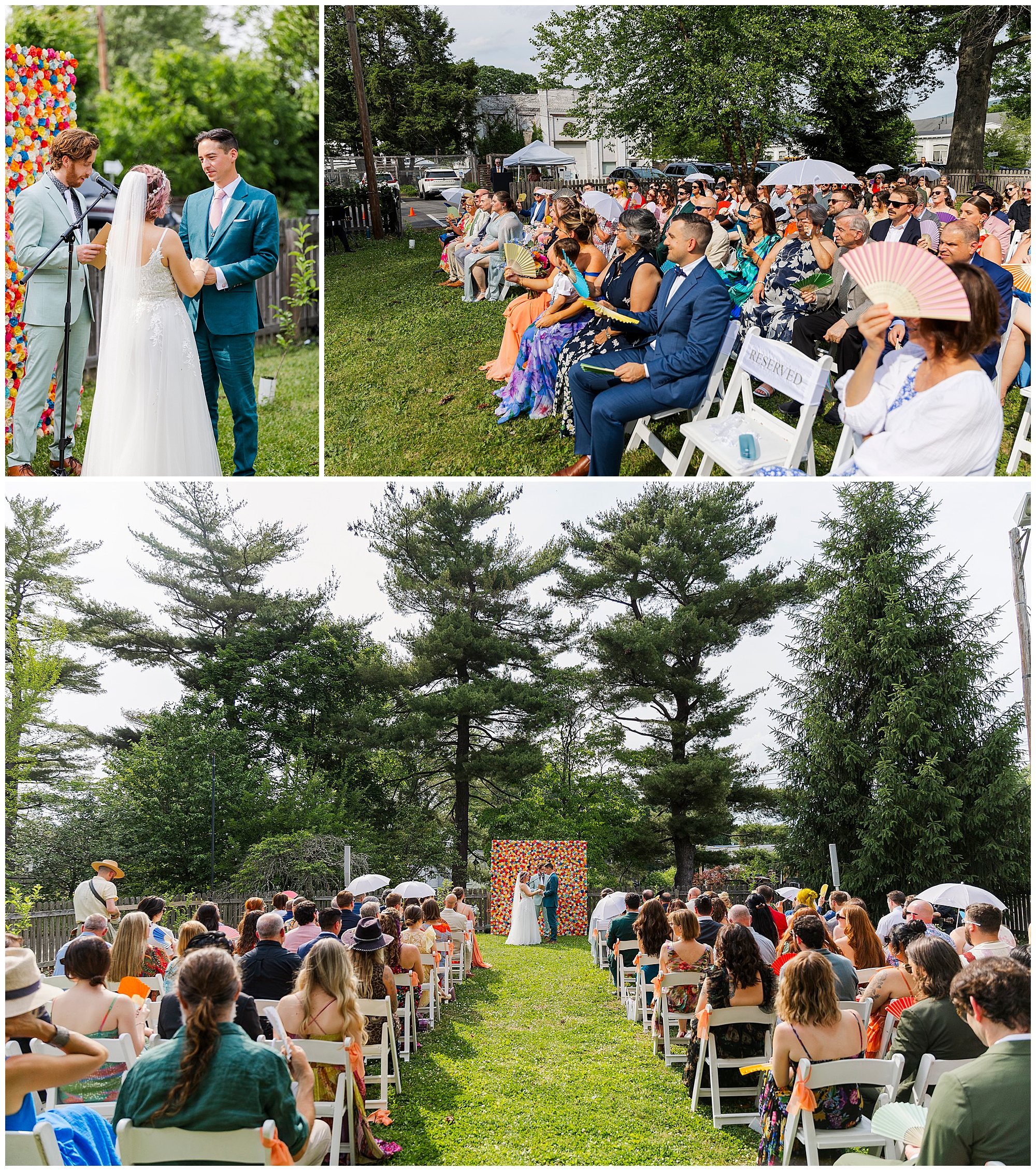 A wedding at the yard unfolds outdoors: a couple stands with an officiant by a colorful floral arch, while seated guests watch, some using fans to keep cool under partly cloudy skies.