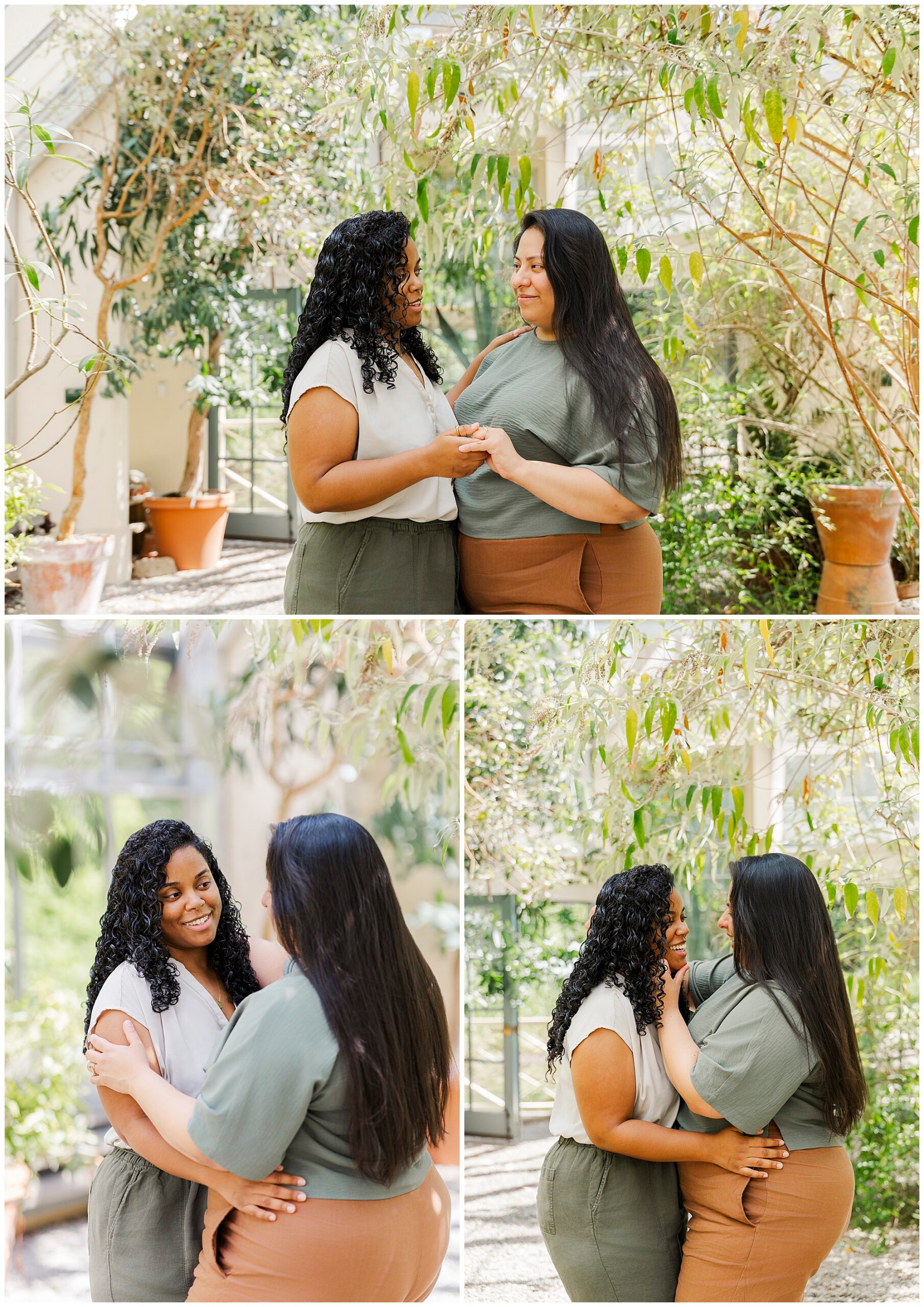 Two women stand close together in a sunlit indoor garden at Stonecrop Gardens, smiling and holding hands. They look happy and affectionate, surrounded by green plants and terracotta pots—perfect LGBTQ engagement photos.